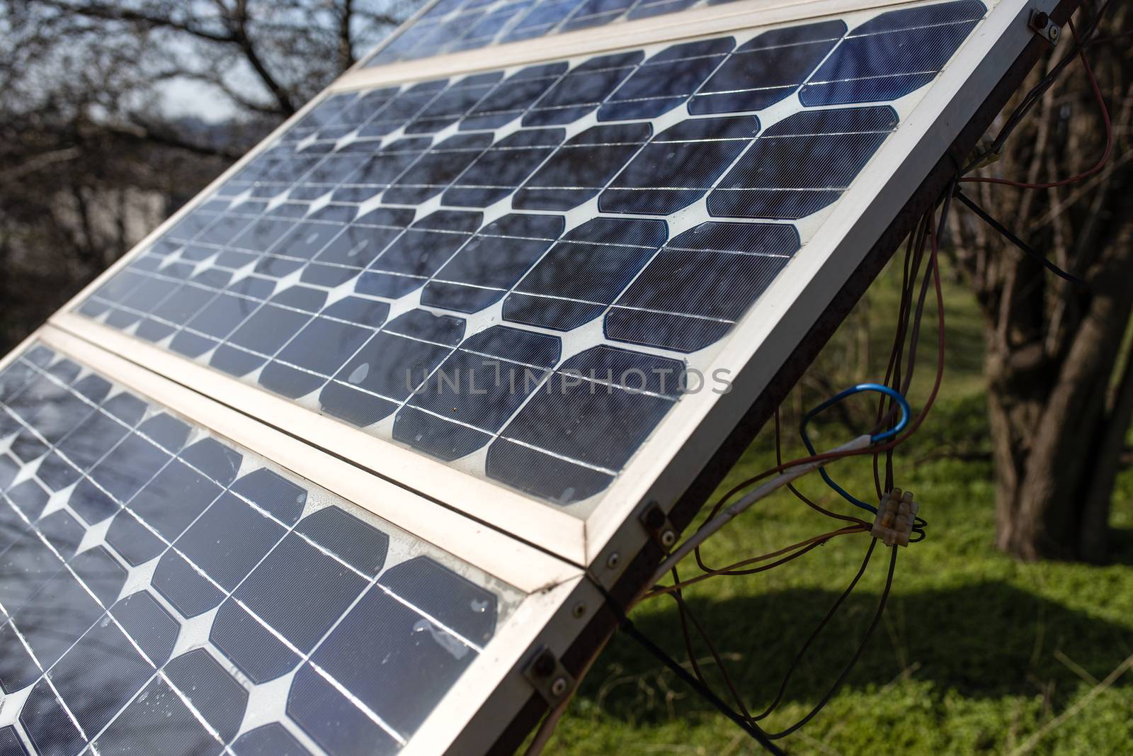 Old small solar panel photovoltaic electric system for home in the village. Alternative energy concept.