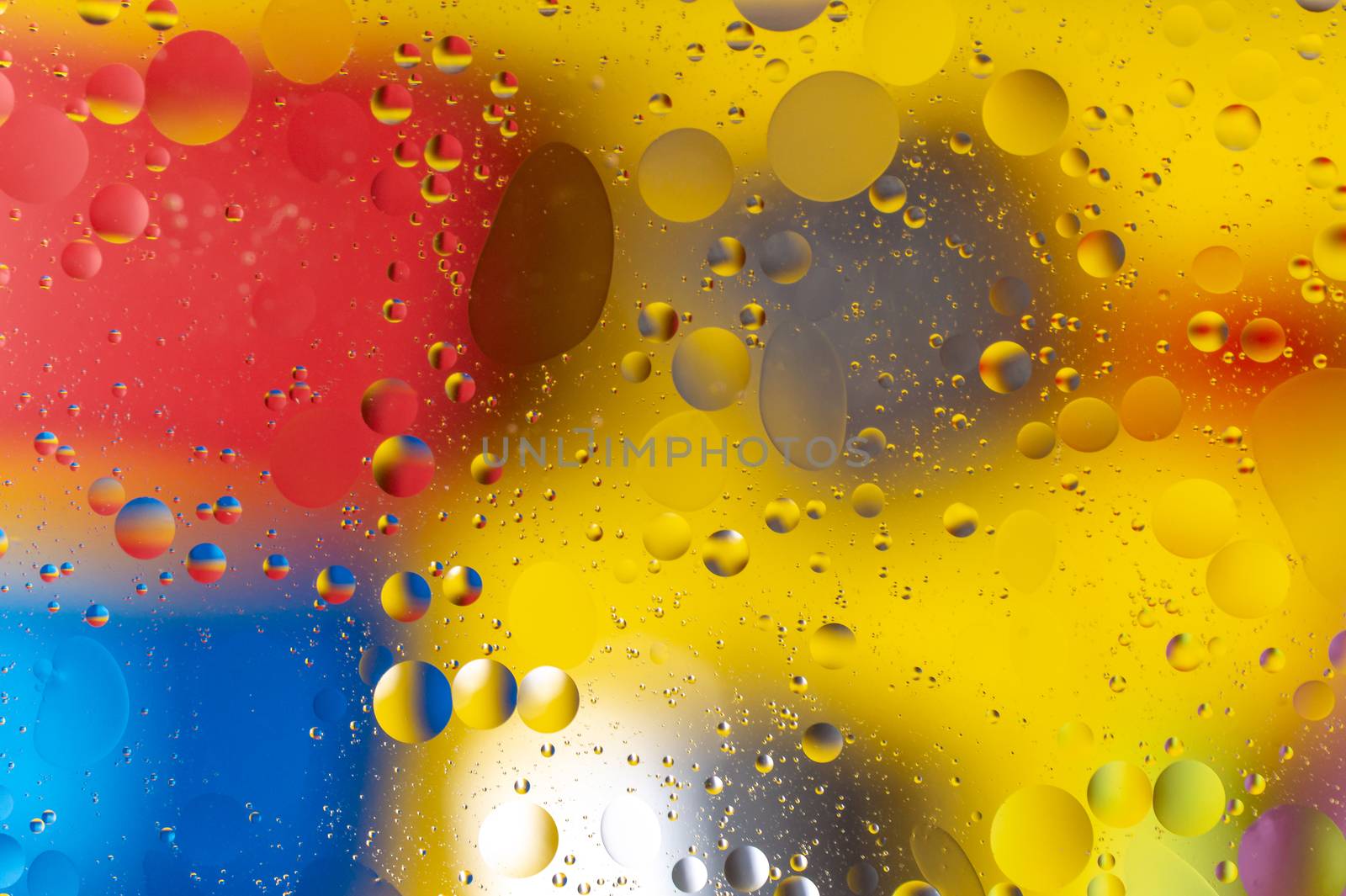 The abstract composition with oil drops in water. A lot of round drops.