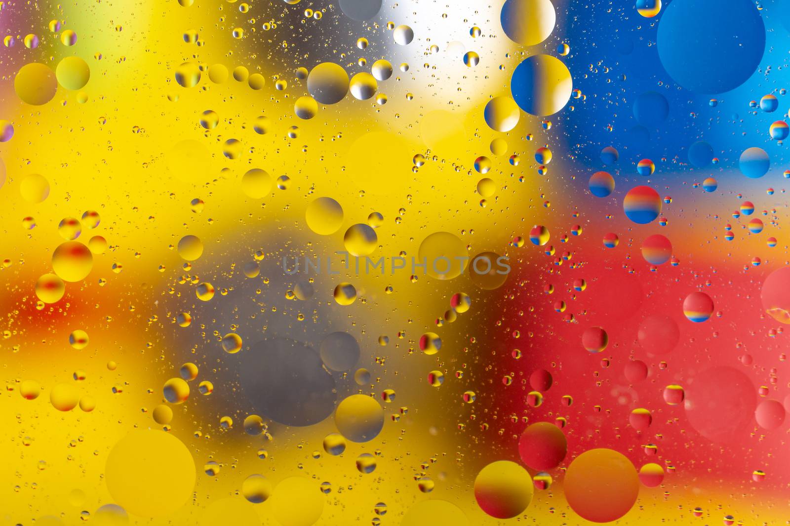 The abstract composition with oil drops in water. The abstract composition with oil drops in water. Many round drops on water surface.