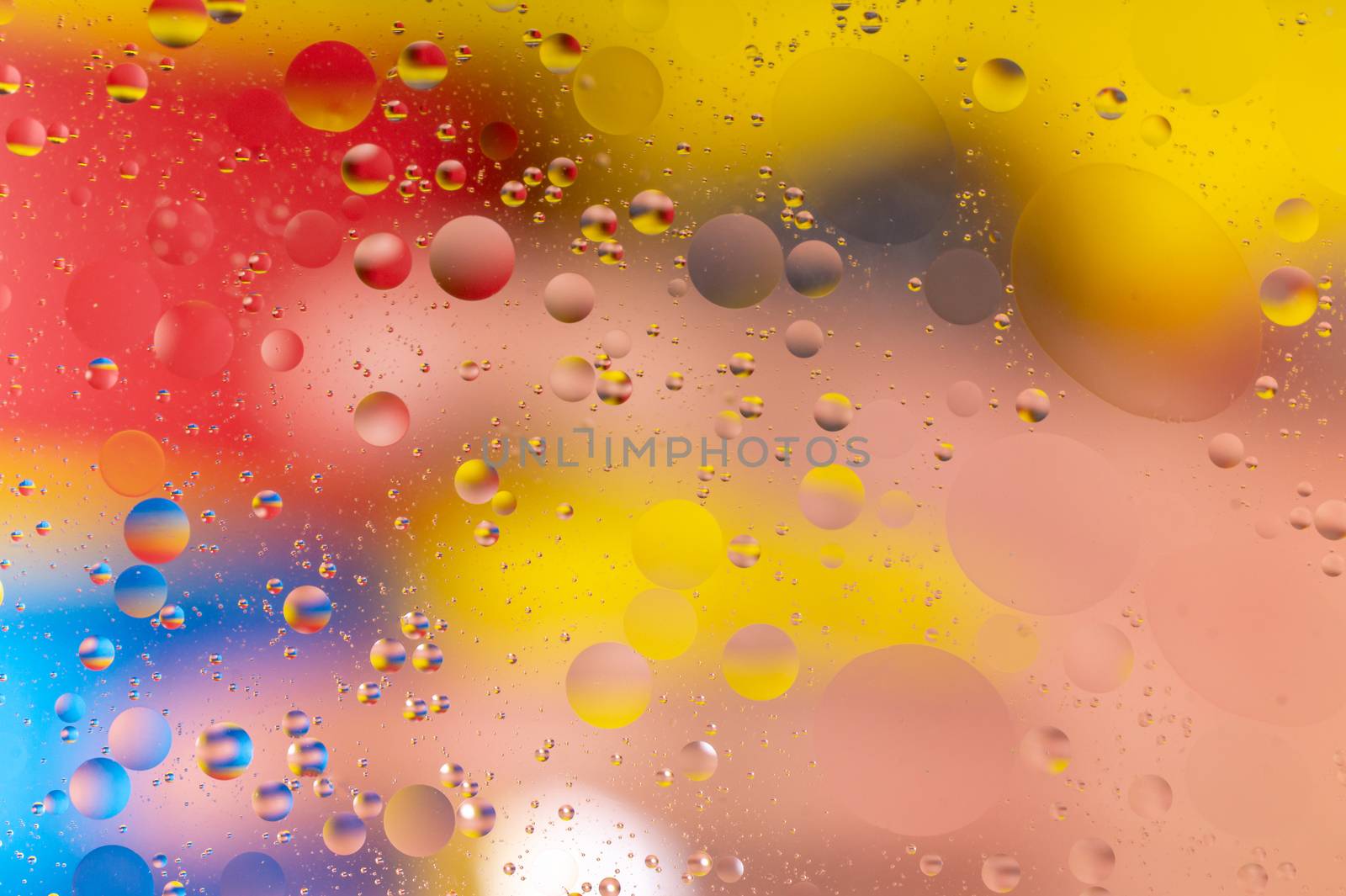 The abstract composition with oil drops in water. The abstract composition with oil drops in water. Many round drops on water surface.