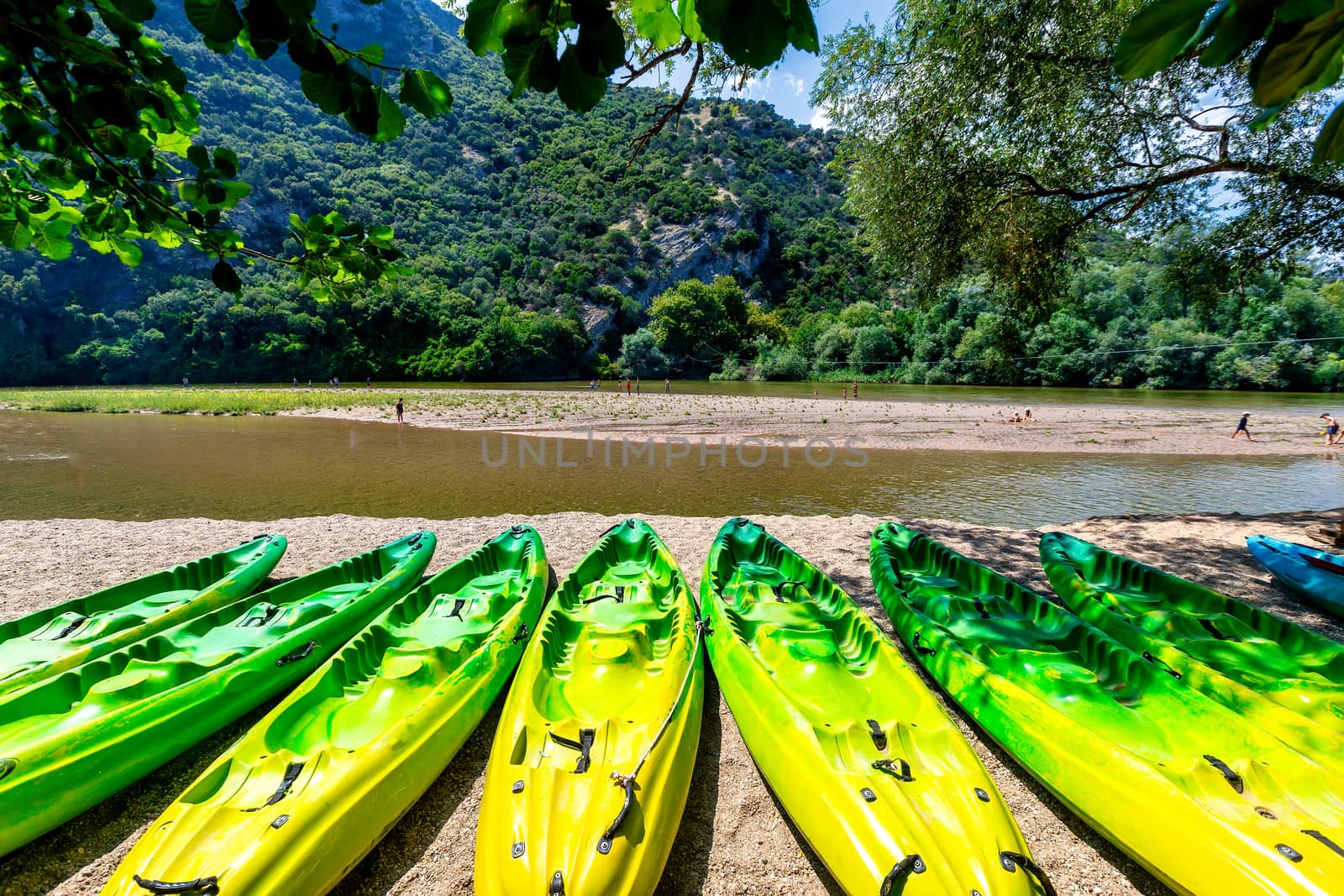 kayak parked on the shore of a beautiful beach of the river Nest by ververidis