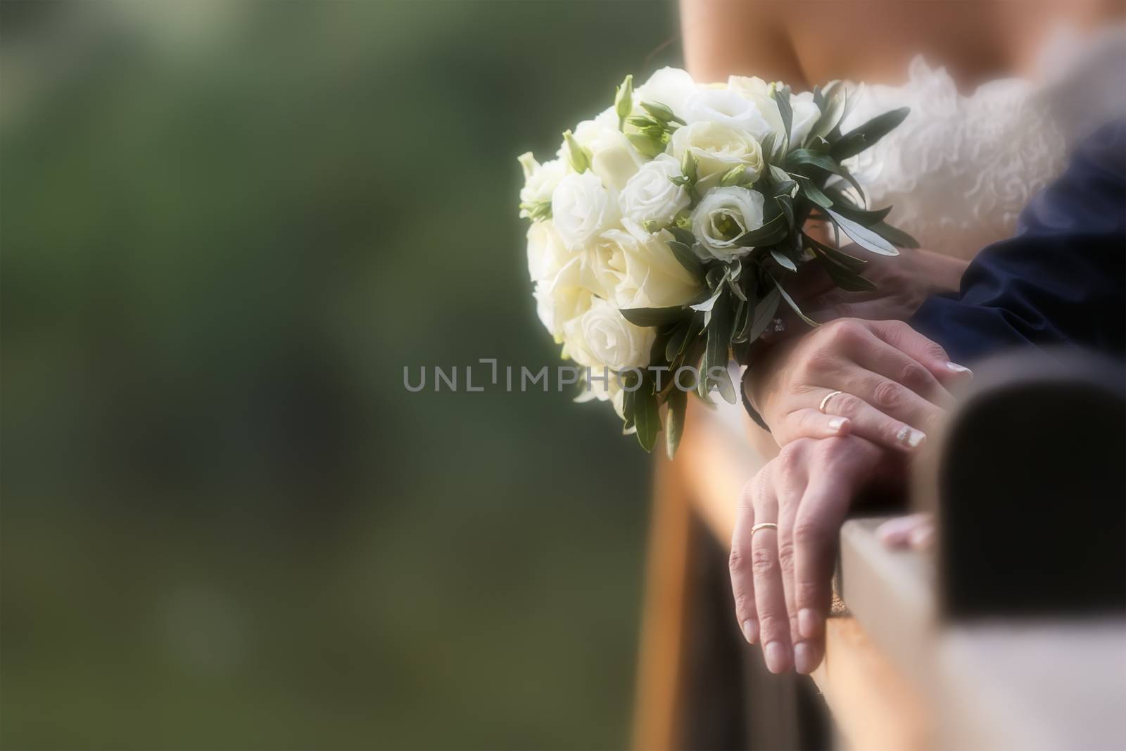 Bride and groom's hands with wedding rings (soft focus), filter  by ververidis