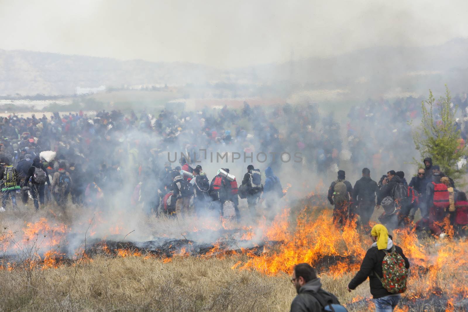 Thessaloniki, Greece - April 5, 2019: Hundreds of migrants and refugees gathered outside of a refugee camp in Diavata to walk until the Northern borders of Greece to pass to Europe.