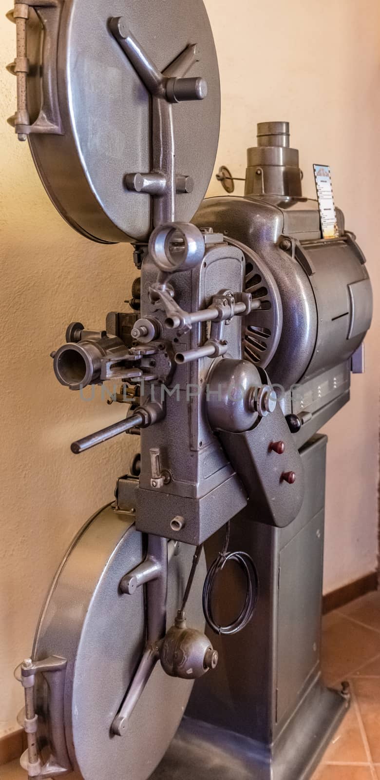 Old movie projector for cinema. Vintage movie camera keep in museum. It is use with retro film. But the body is classic design. The vintage cinema projector is analog and difficult to use it.
