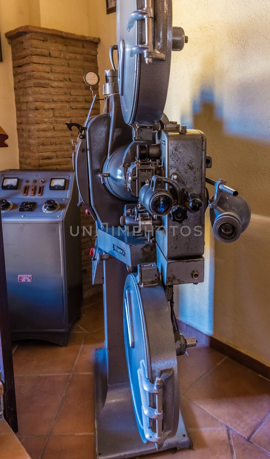 Old movie projector for cinema. Vintage movie camera keep in museum. It is use with retro film. But the body is classic design. The vintage cinema projector is analog and difficult to use it. by jcdiazhidalgo