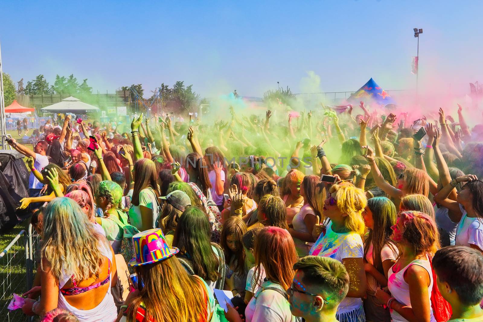 Thessaloniki, Greece - September 2, 2018: Crowds of unidentified people throw colour powder during the "Day of Colours" annual event.