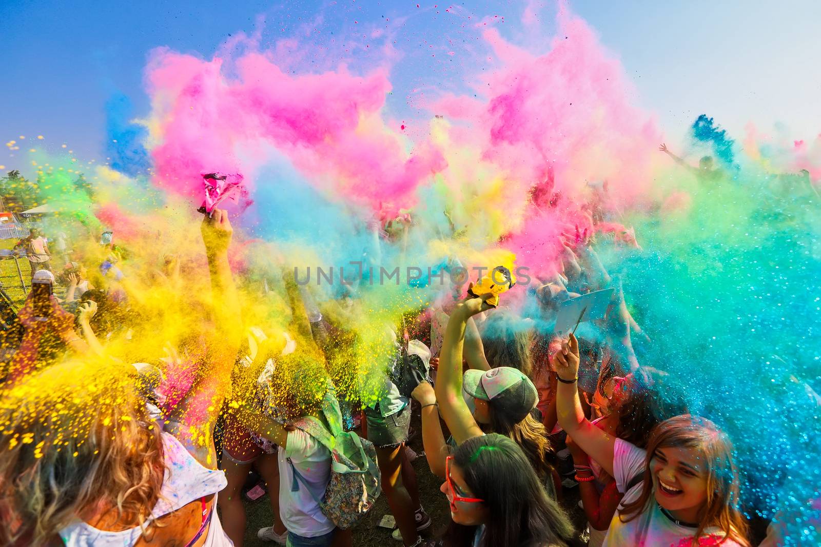 Thessaloniki, Greece - September 2, 2018: Crowds of unidentified people throw colour powder during the "Day of Colours" annual event.
