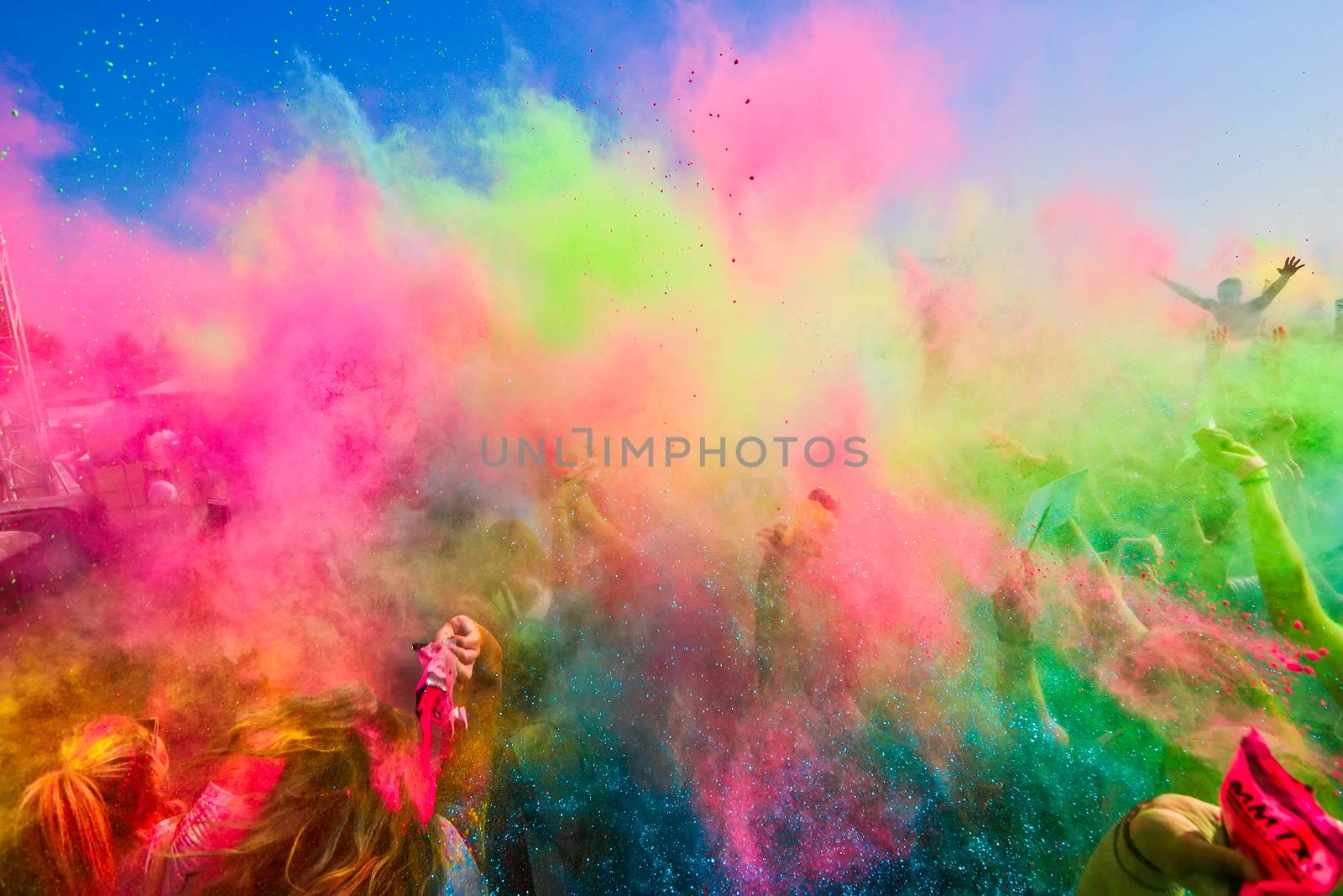 Thessaloniki, Greece - September 2, 2018: Crowds of unidentified people throw colour powder during the "Day of Colours" annual event.