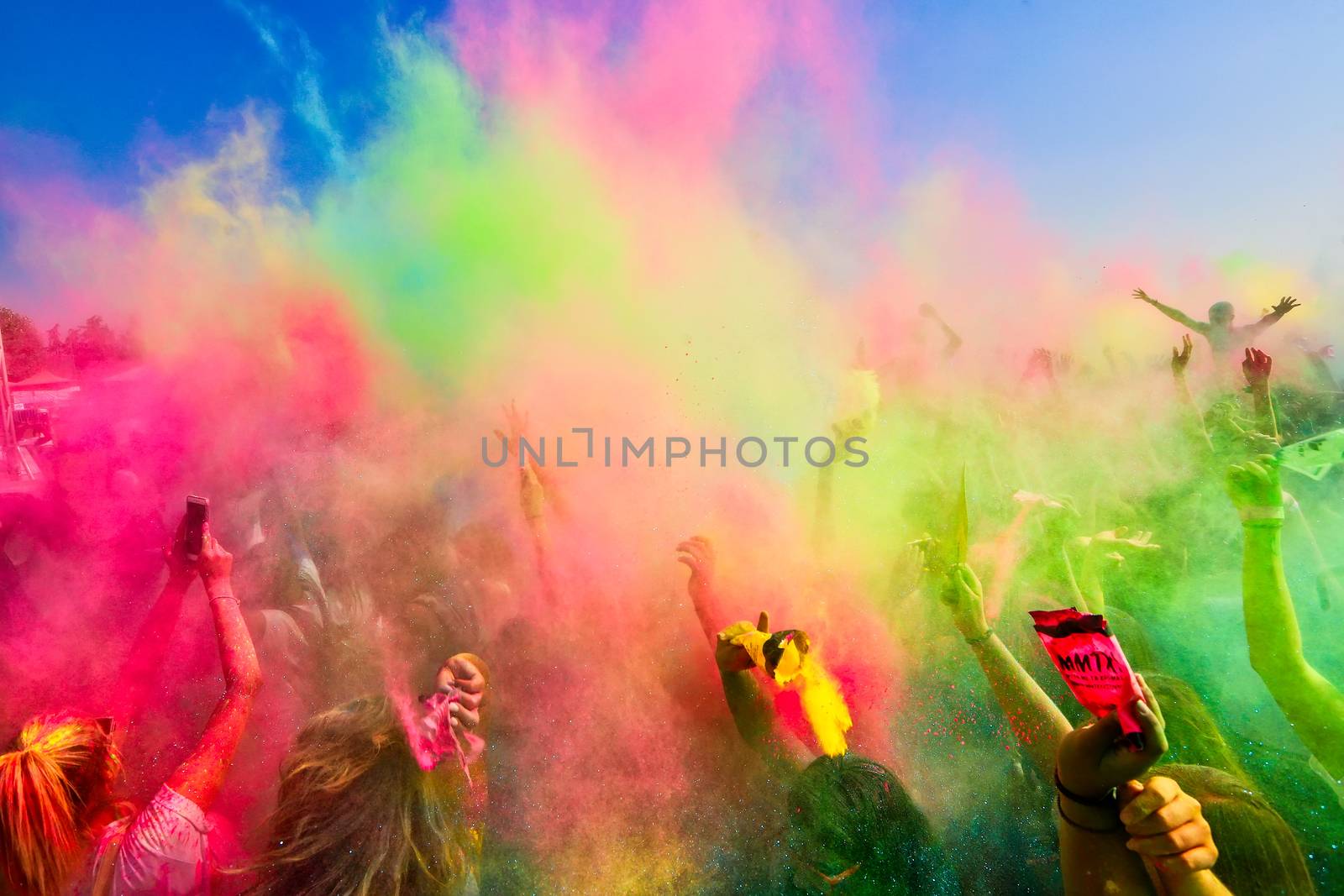 Thessaloniki, Greece - September 2, 2018: Crowds of unidentified people throw colour powder during the "Day of Colours" annual event.