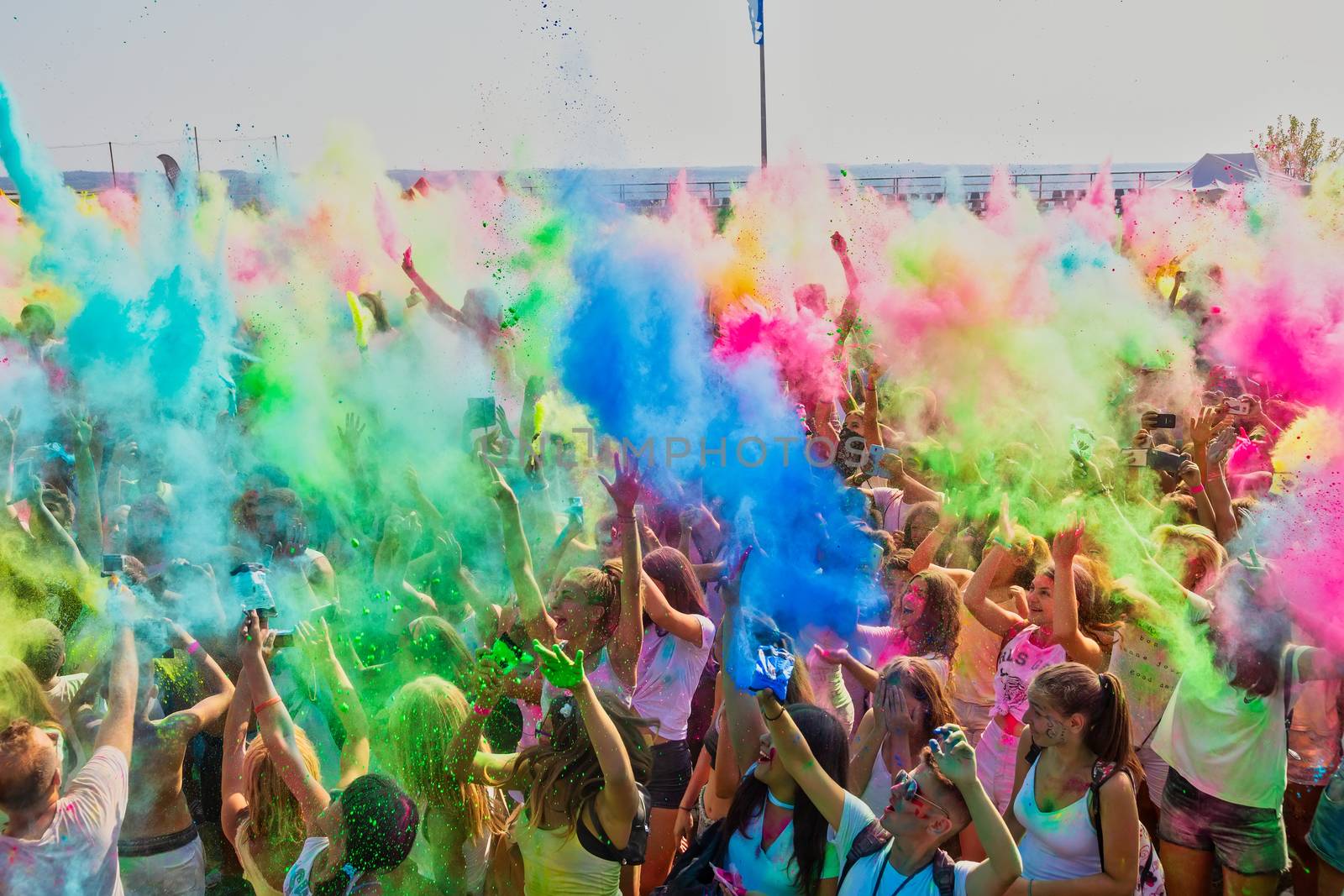 people throw colour powder during the "Day of Colours" annual ev by ververidis