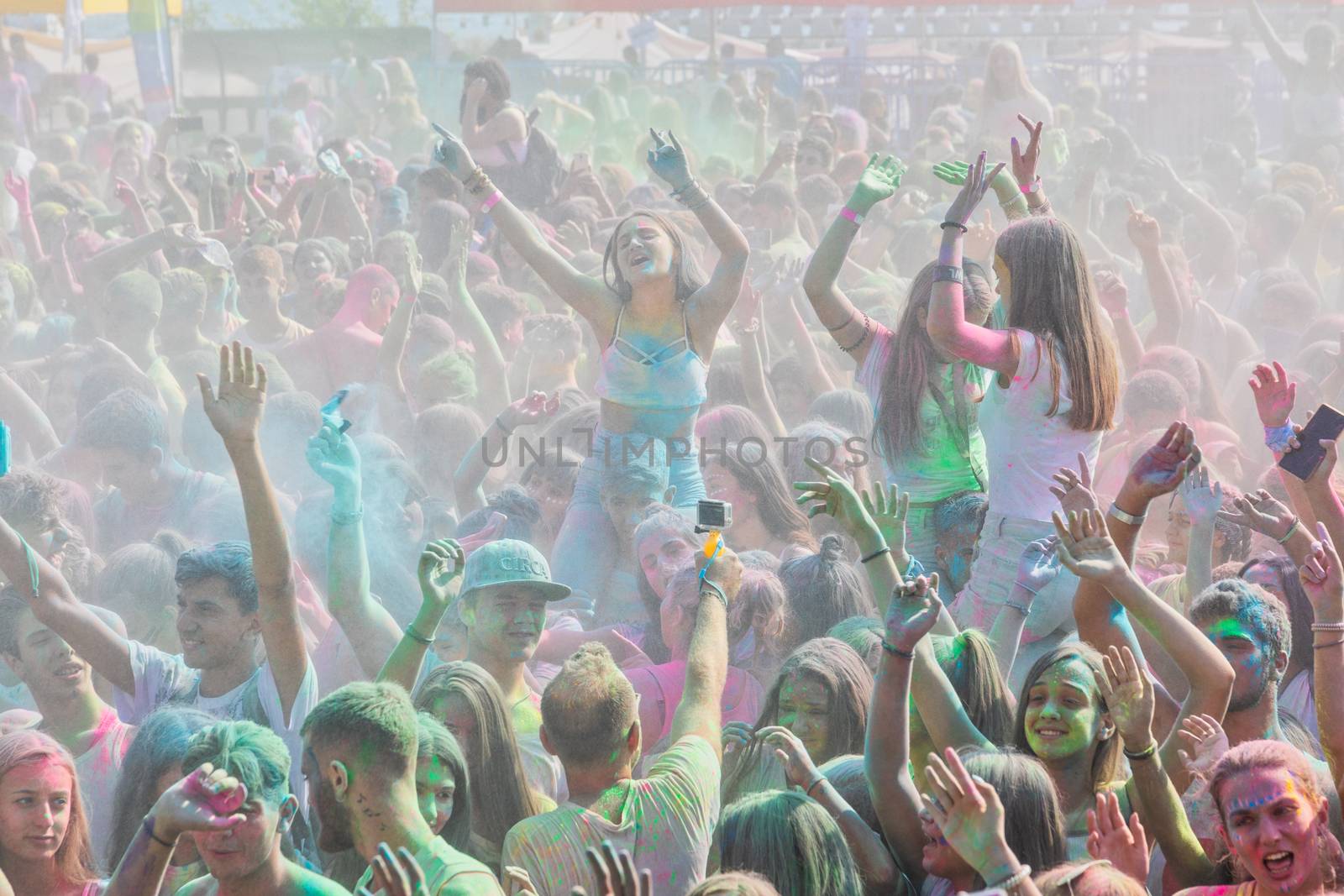 people throw colour powder during the "Day of Colours" annual ev by ververidis