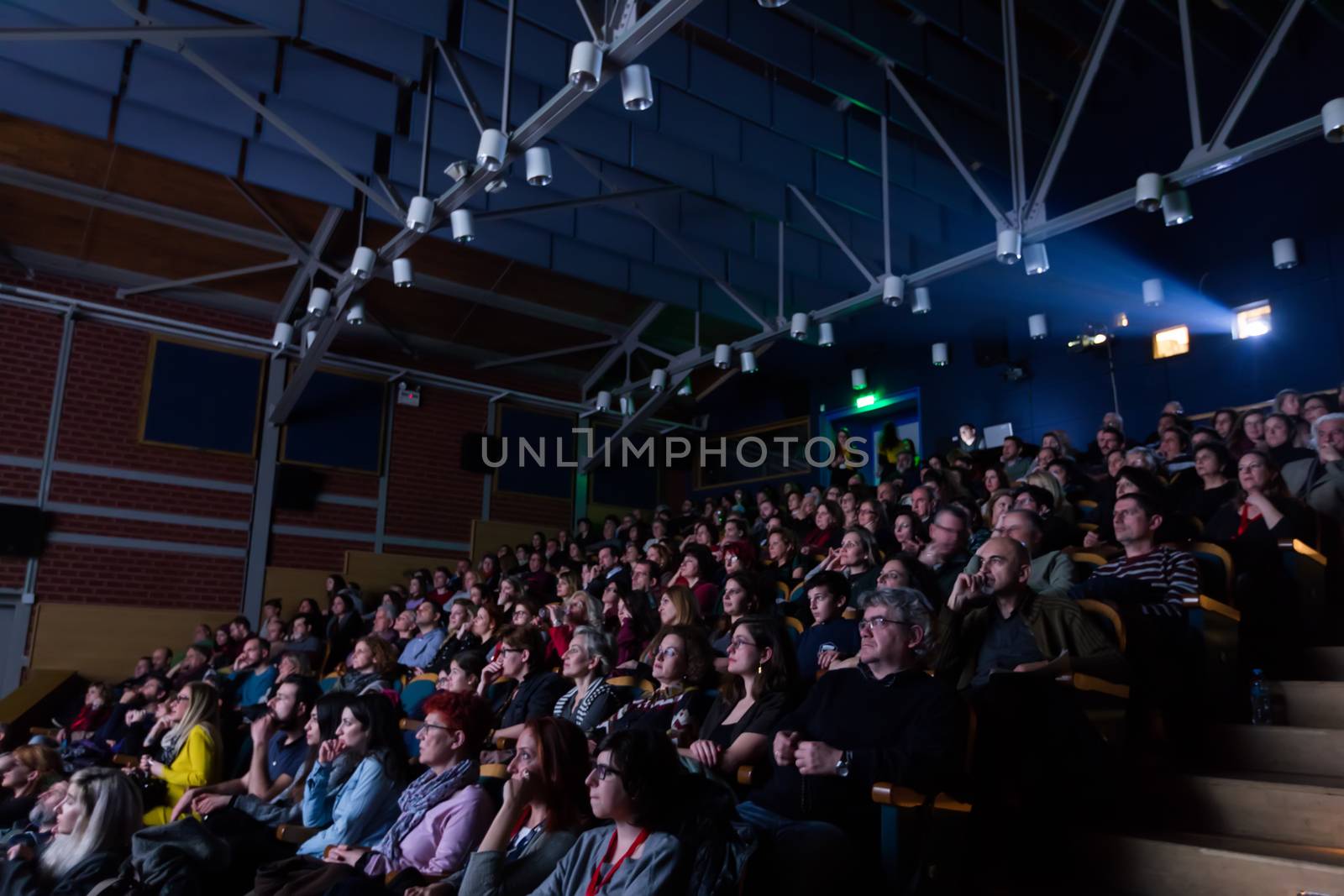 Spectators watching in the cinema by ververidis