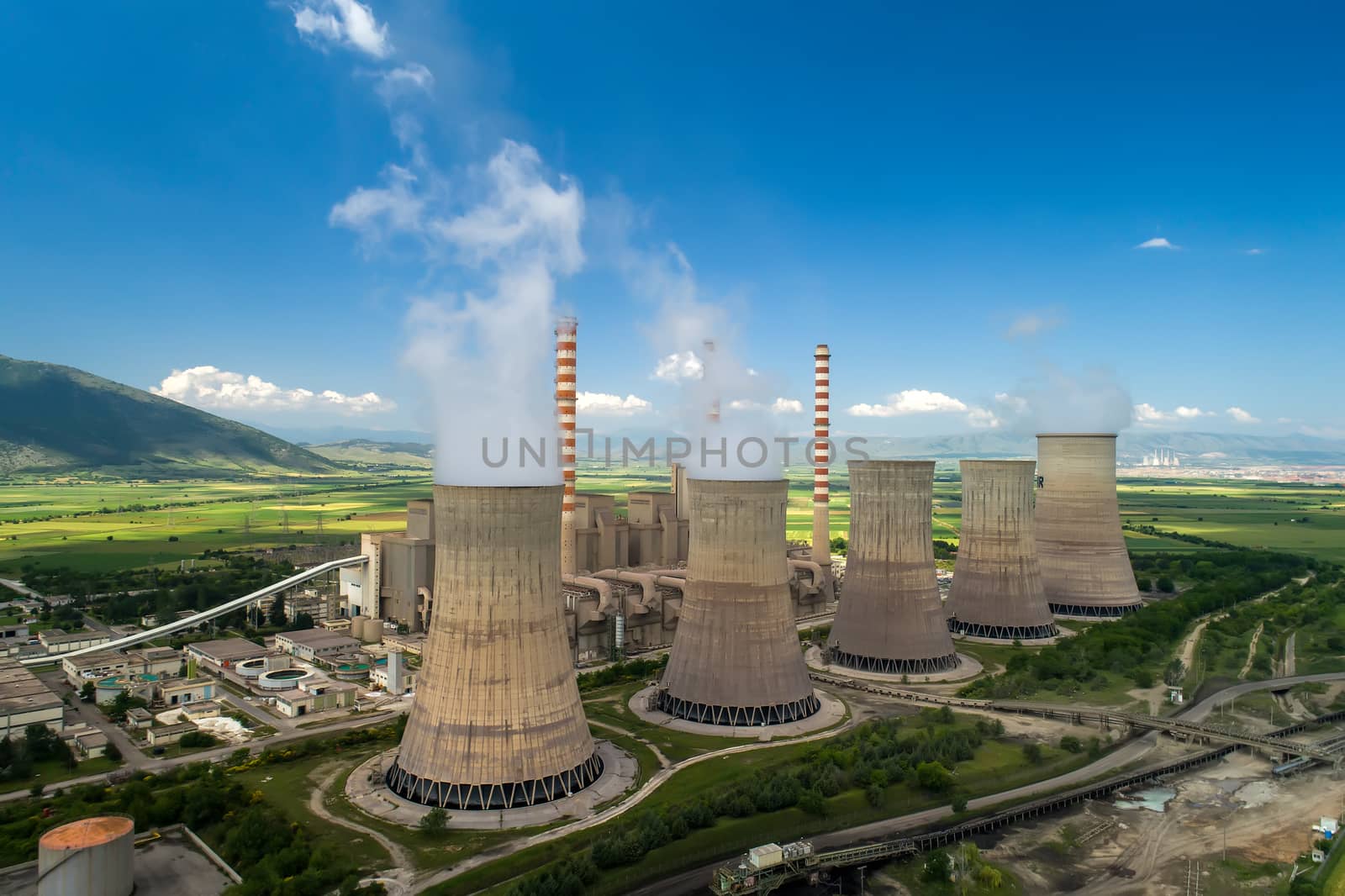 Aerial view the plant producing electrical energy with large pipes at Kozani in northern Greece.