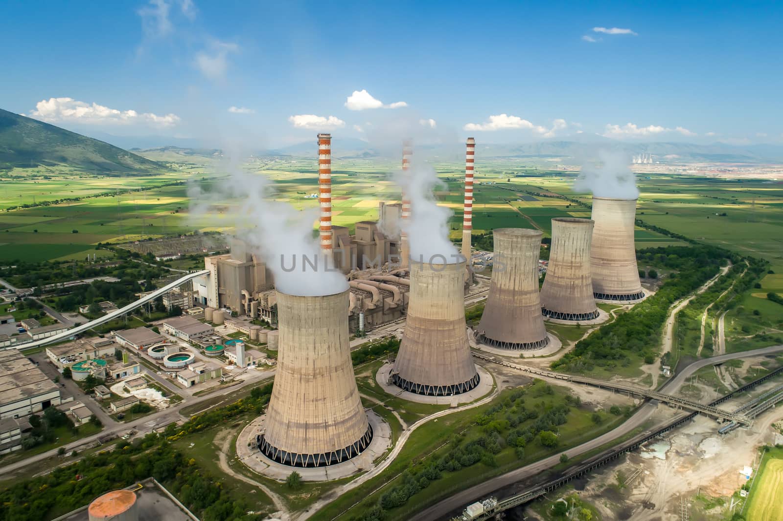 Aerial view the plant producing electrical energy with large pipes at Kozani in northern Greece.