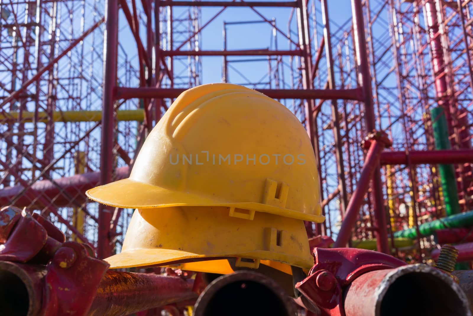 yellow hardhat on construction site by ververidis