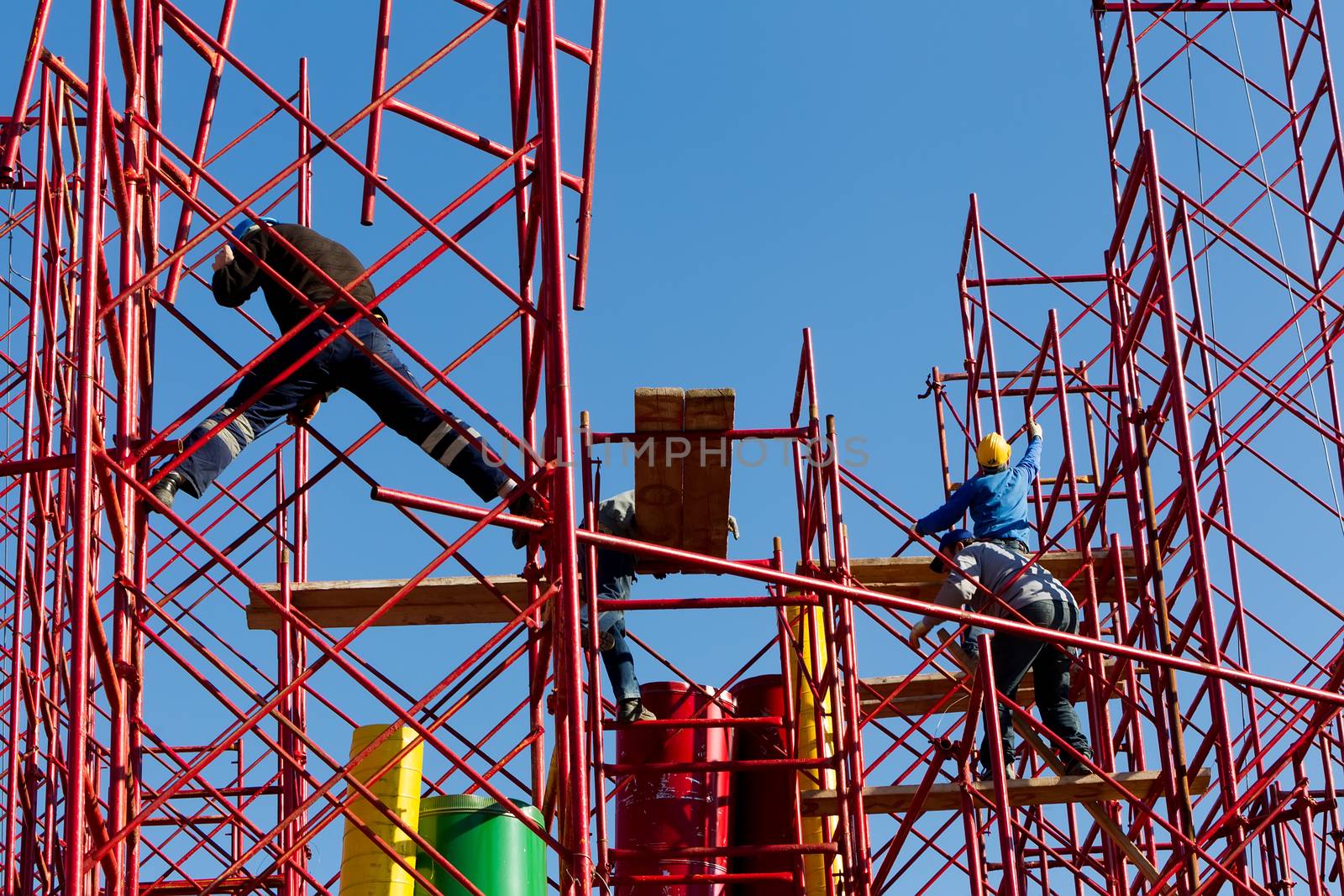 Construction workers building a new structure in city by ververidis