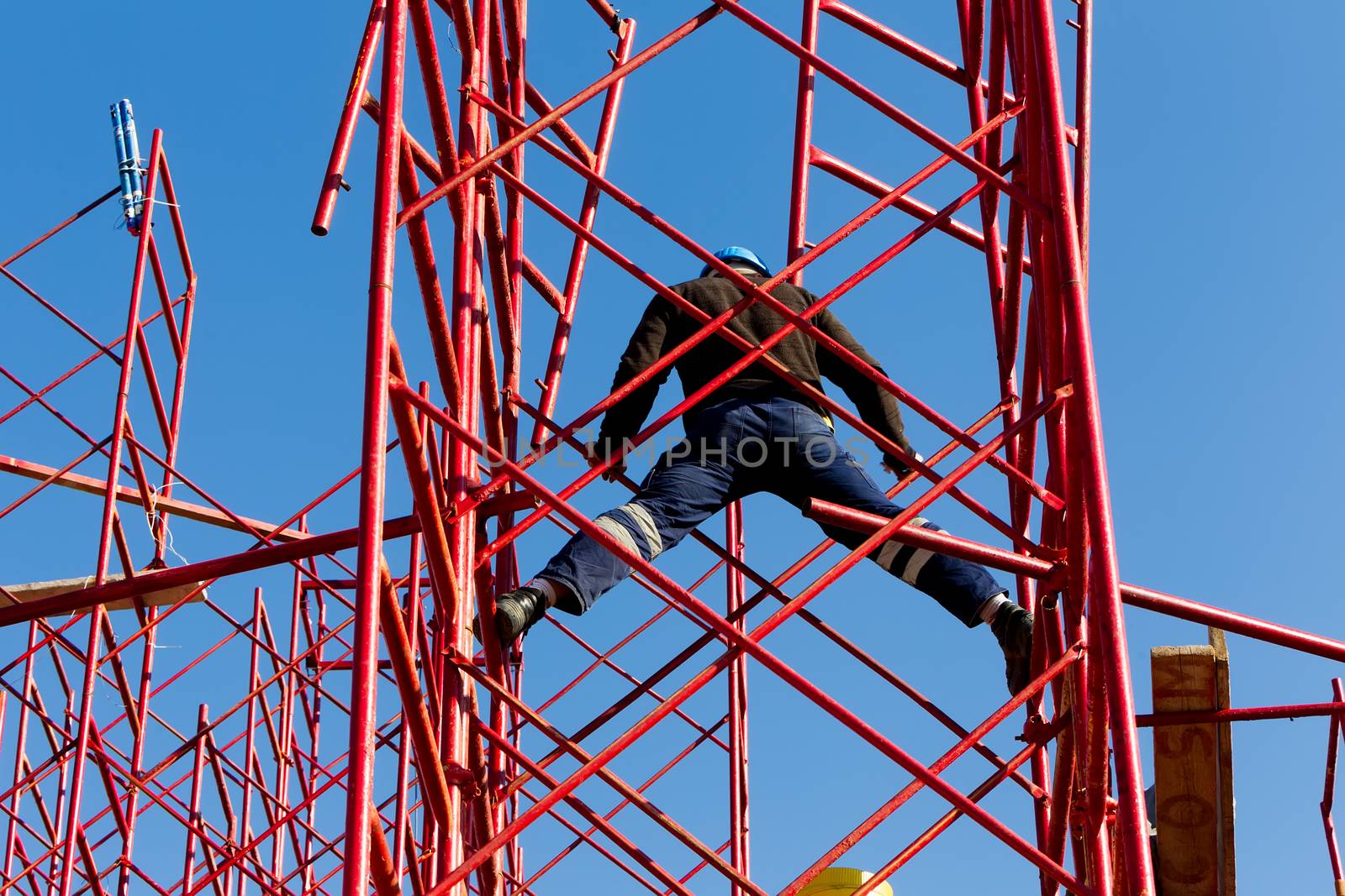 Construction workers building a new structure in city by ververidis