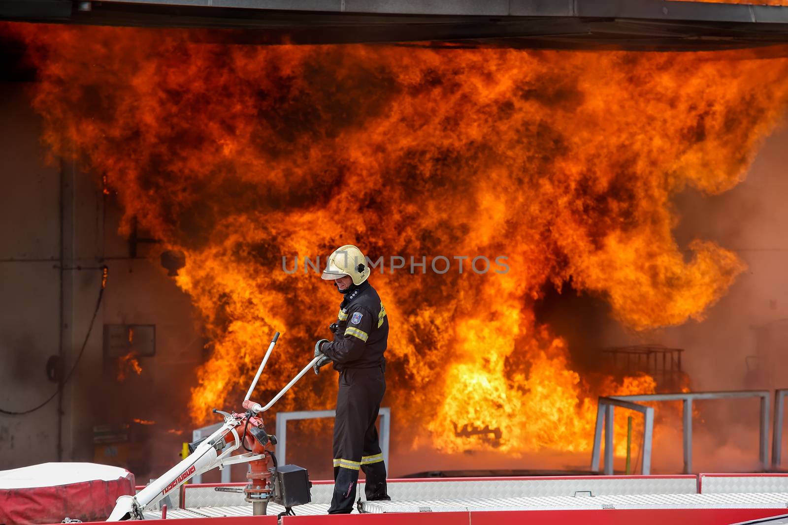 Aspopirgos, Greece - March 28, 2016: Firefighters struggle to extinguish the fire that broke out at a paint factory