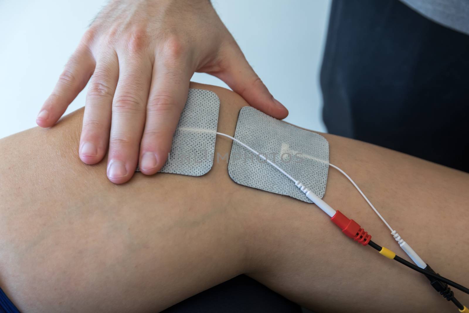 electronic therapy on knee used to treat pain. selective focus by ververidis