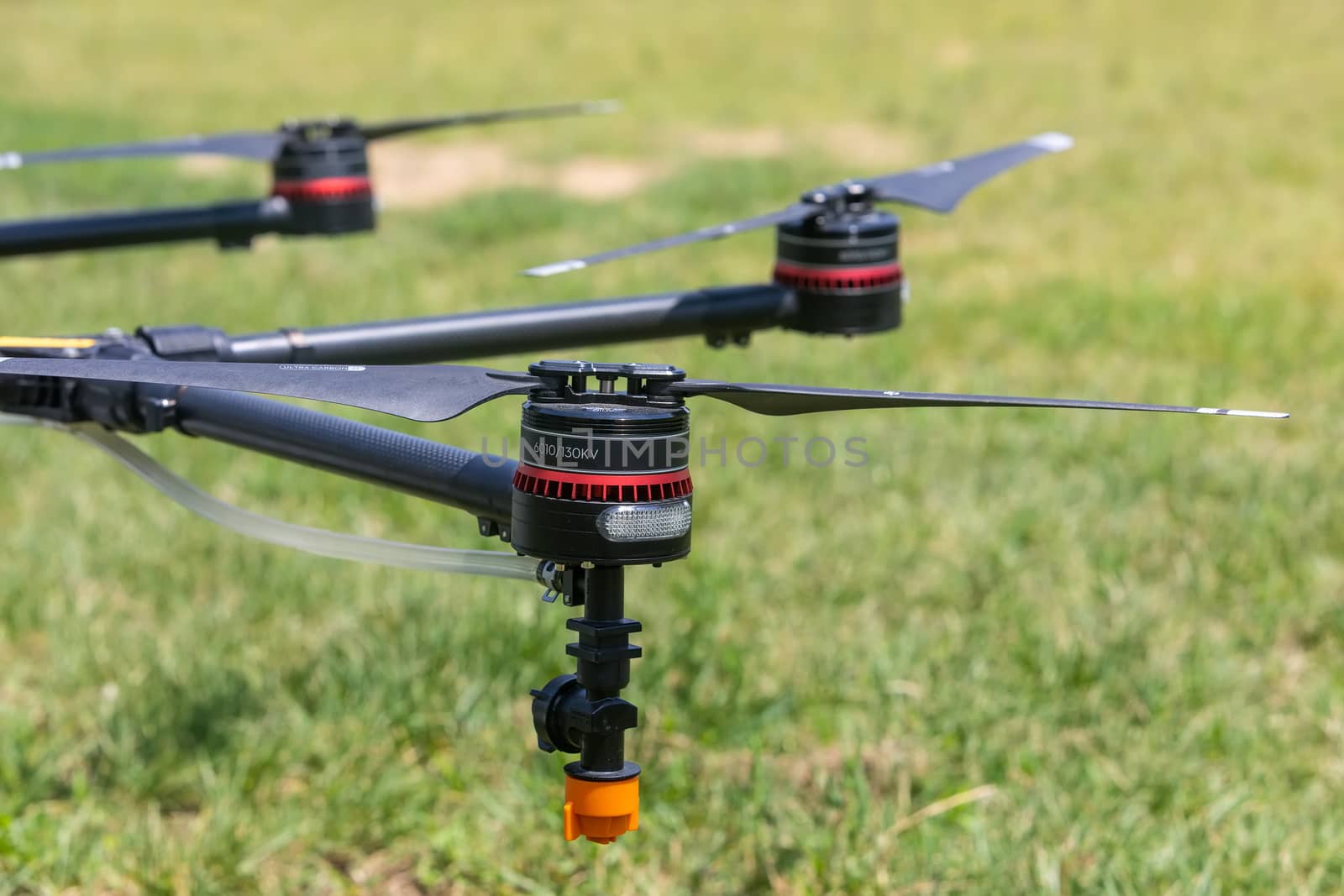 Professional agriculture drone on the green field during pre-fli by ververidis