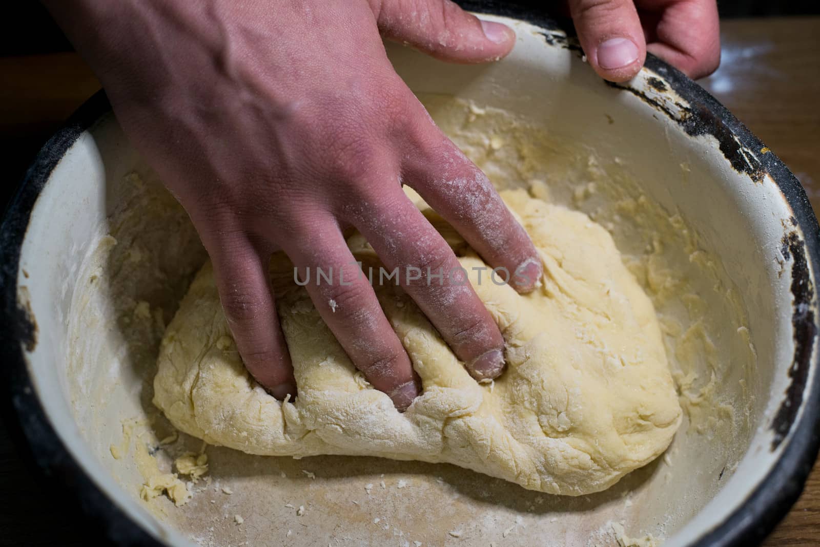 Knead the dough in a bowl by SemFid