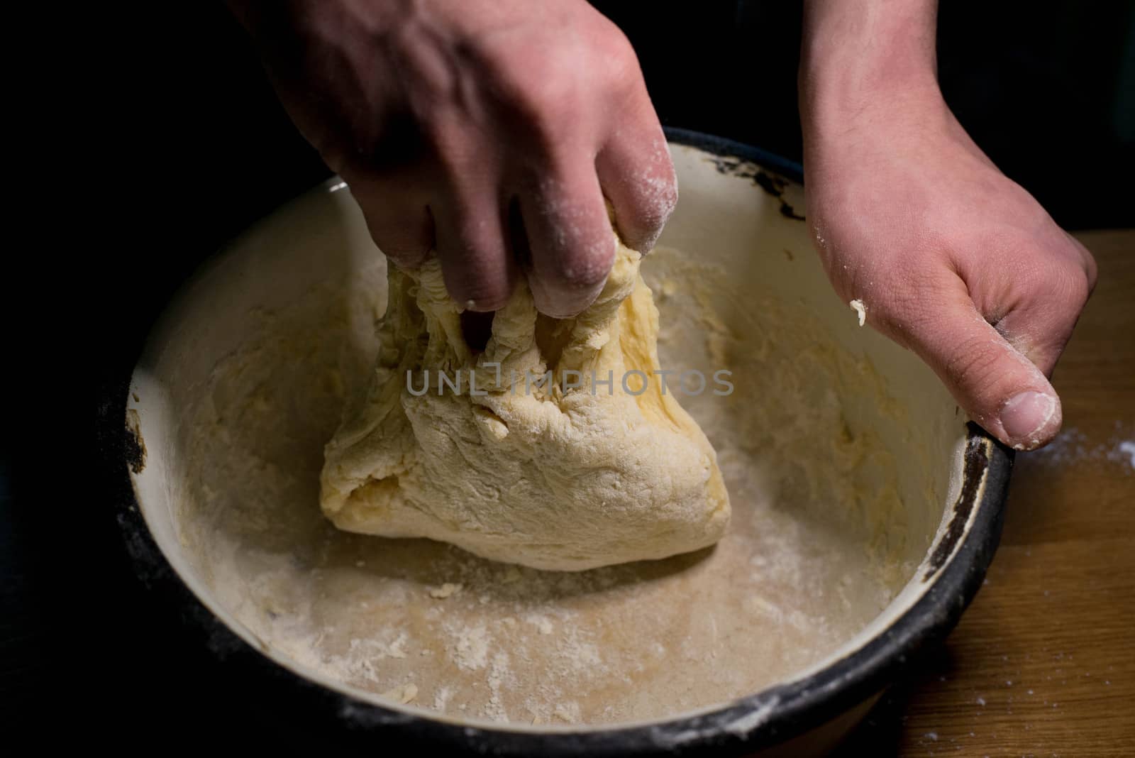 Knead the dough in a bowl by SemFid