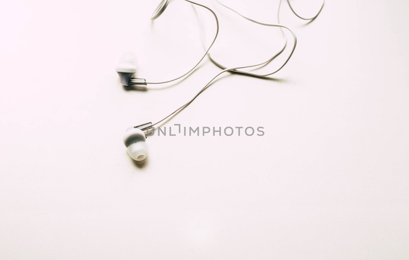 White headphones on a white background