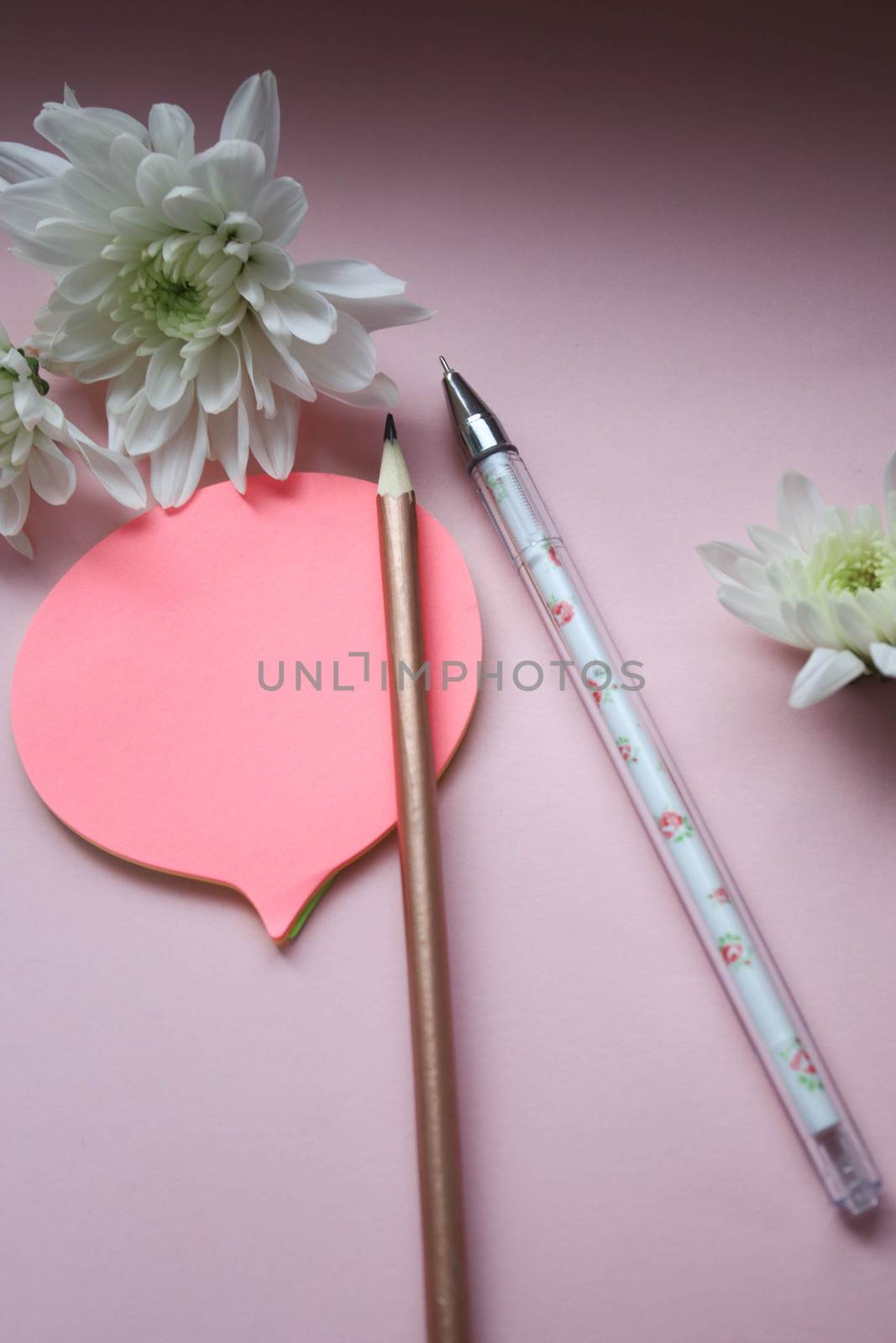 Stickers with pen, pencil and flowers on a pink background by SemFid
