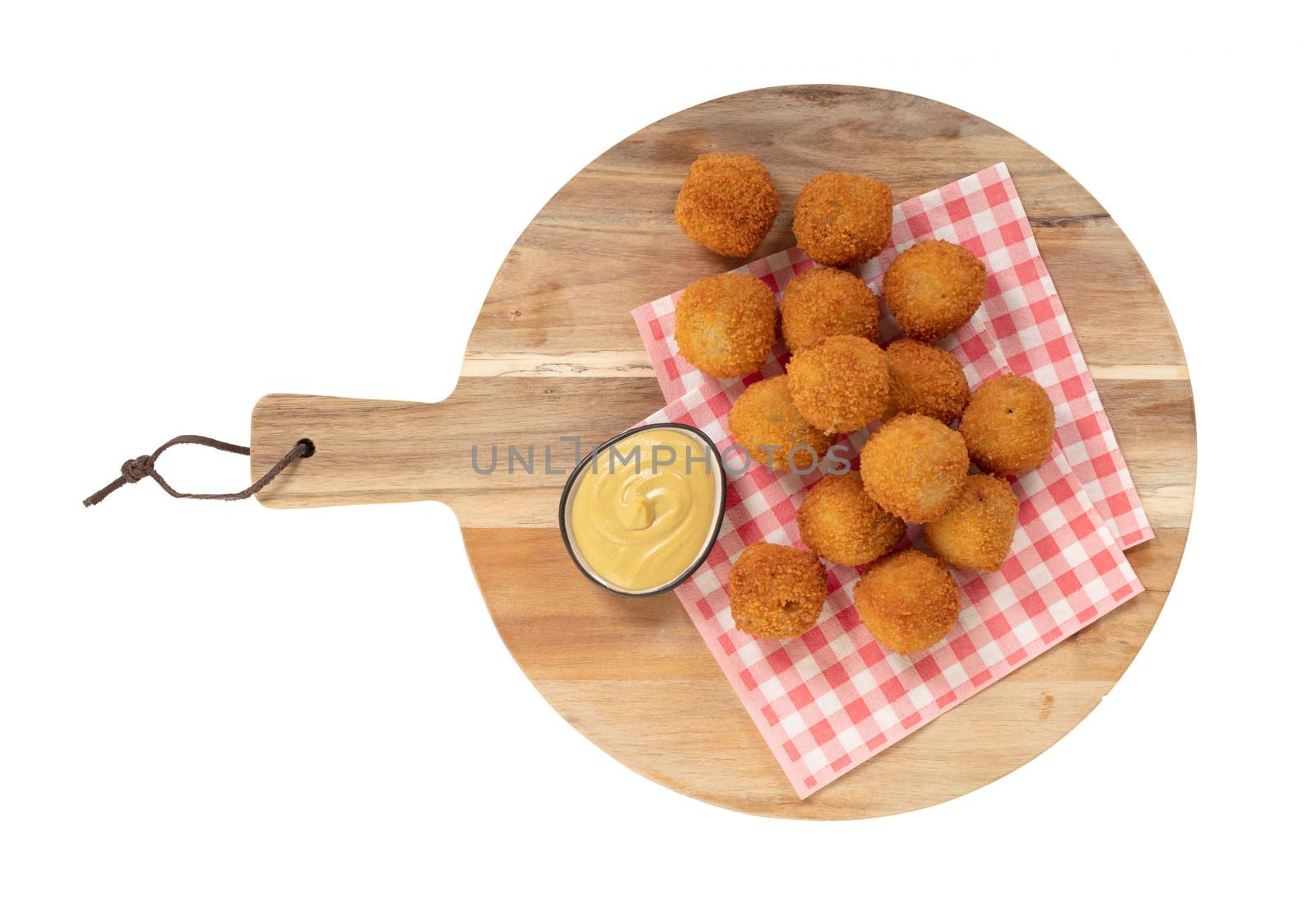 Dutch traditional snack bitterbal on a serving board, isolated