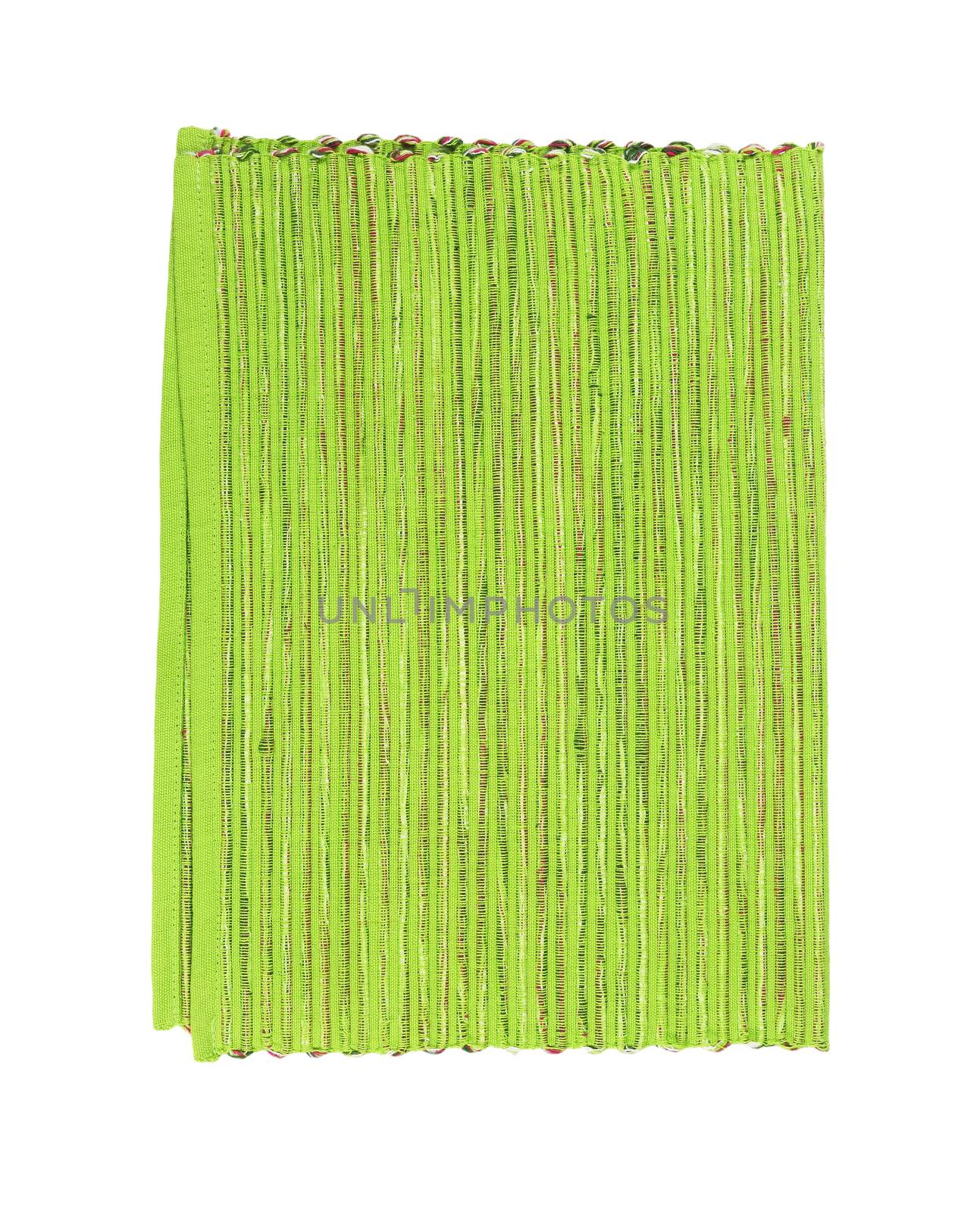 Ribbed green placemat folded in half isolated on white