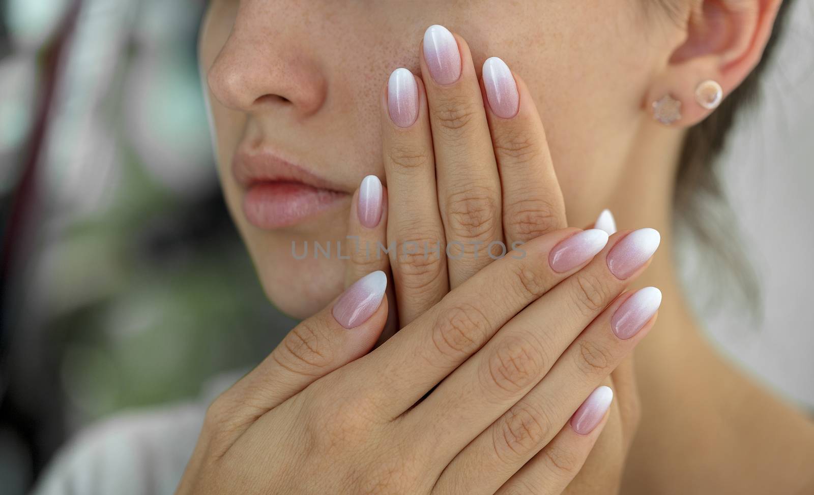 Beautiful woman's nails with beautiful french manicure ombre by Sergii