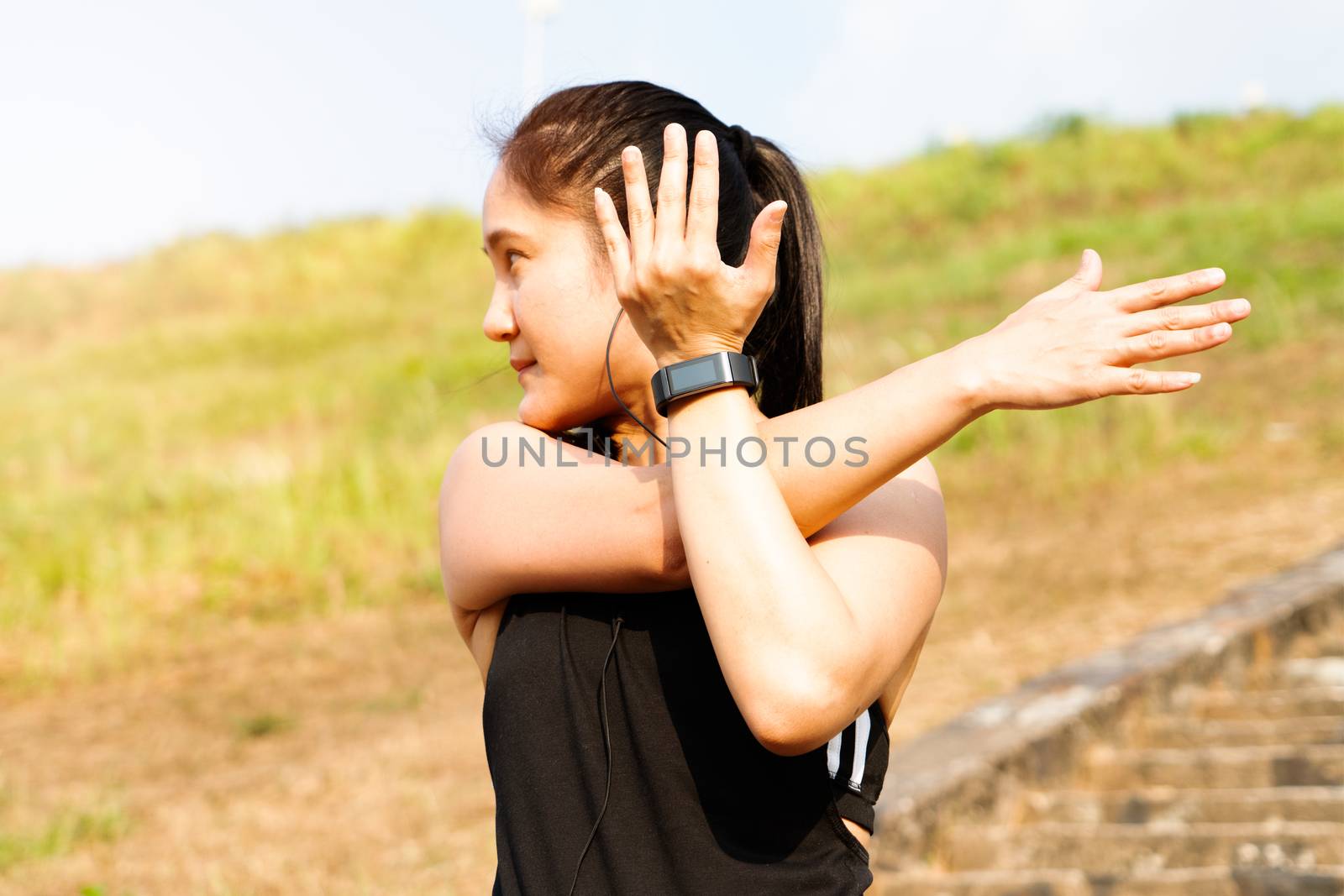 sport woman is stretching muscle before workout