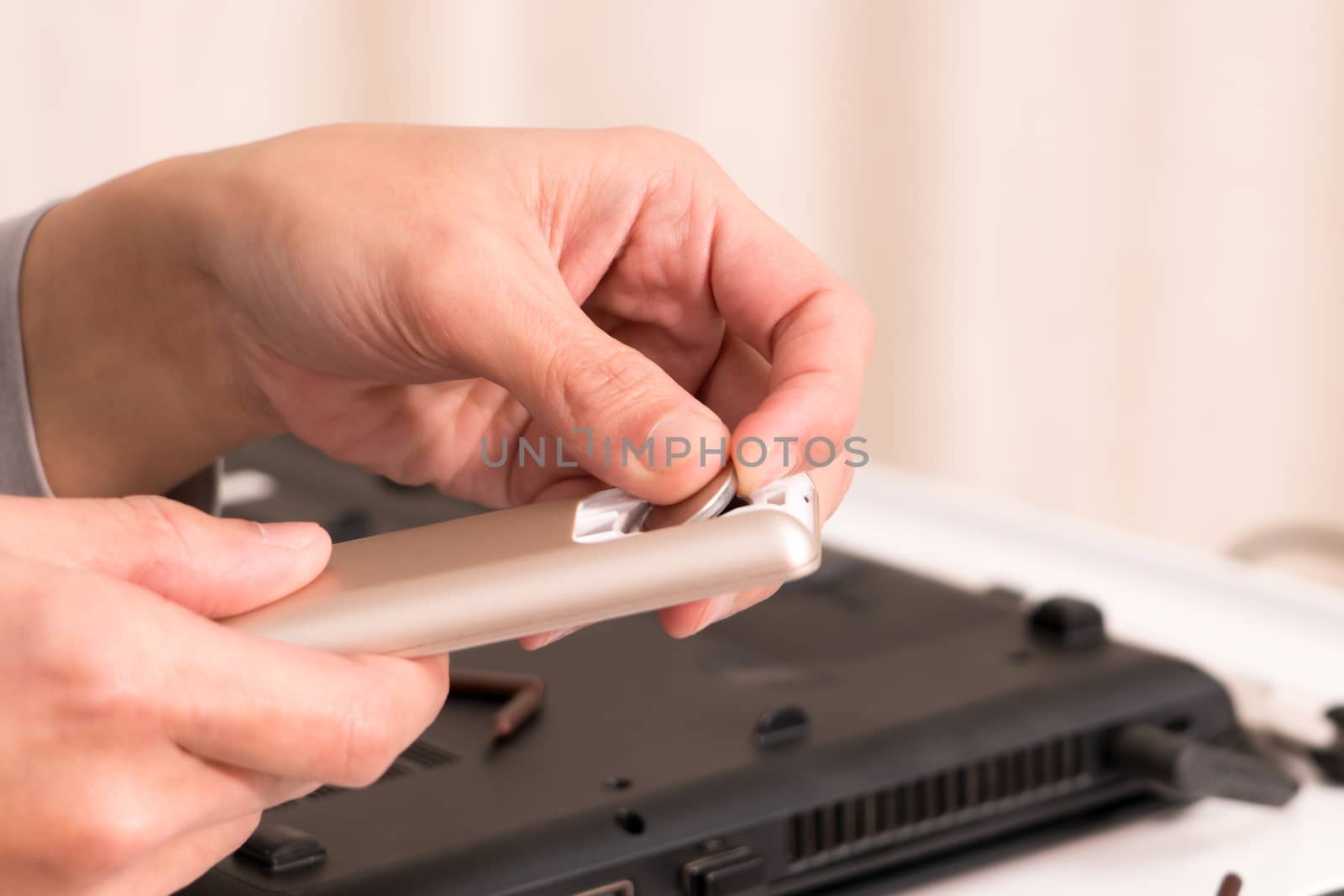 focus on women hand is changing the remote control battery, repair and maintenance