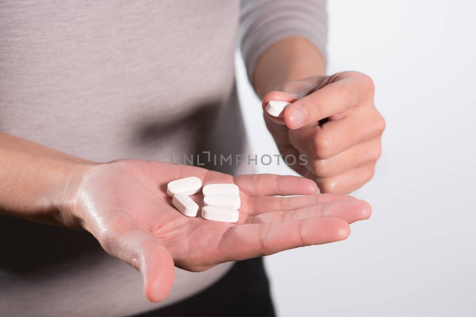 isolate of the women hand holding the medicines, medicine recovery concept