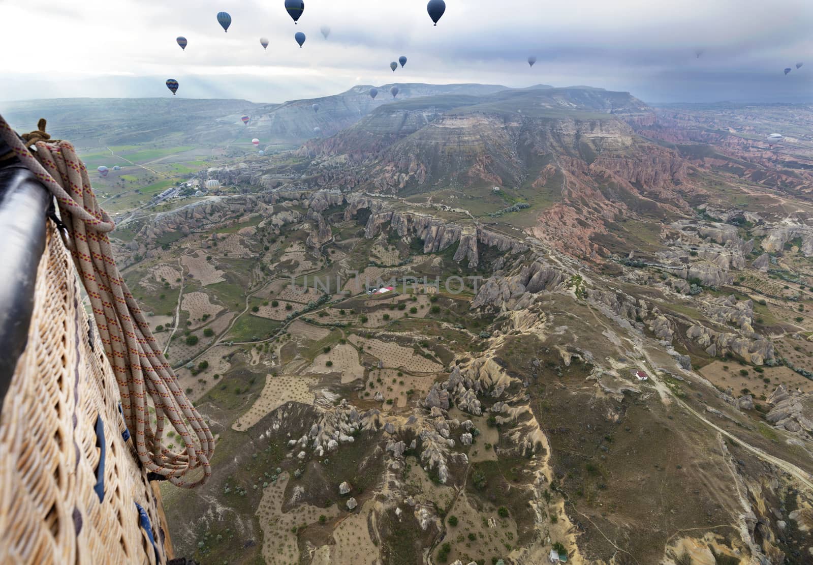 A view of the colorful balloons that fly over the valleys of Cappadocia at dawn. Turkey.