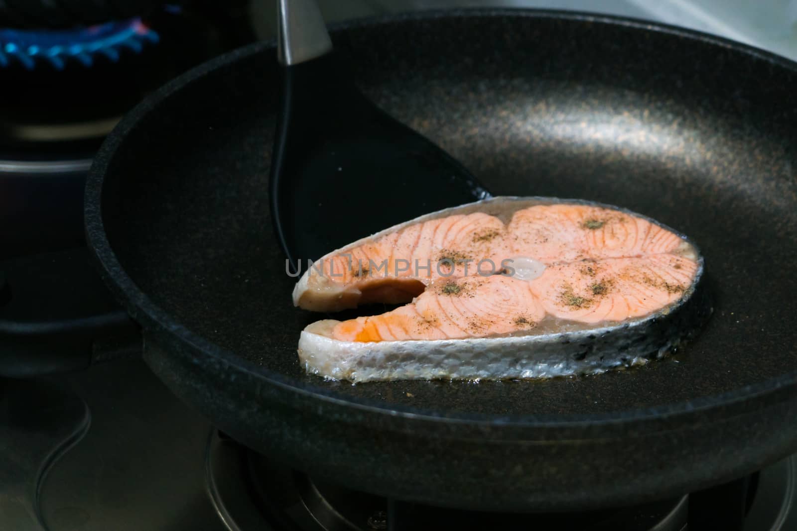 grilled fish salmon fillet on the pan