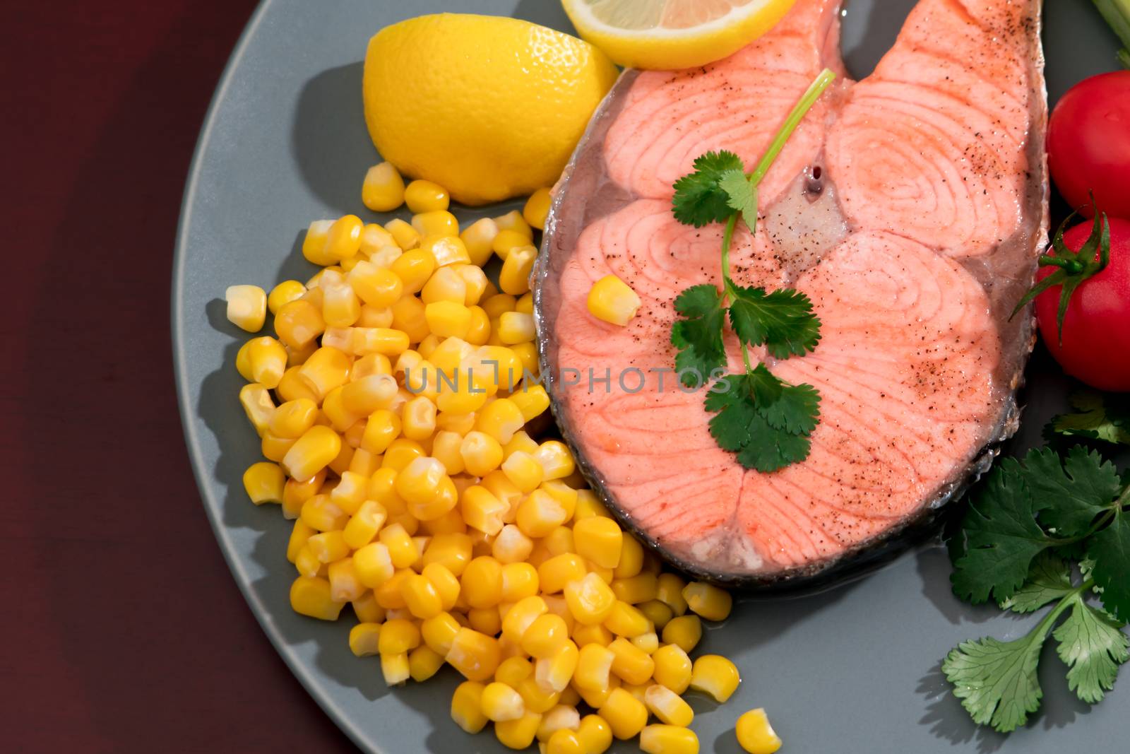 closed-up grilled fish salmon fillet with fresh vegetable, food and vegetable concept
