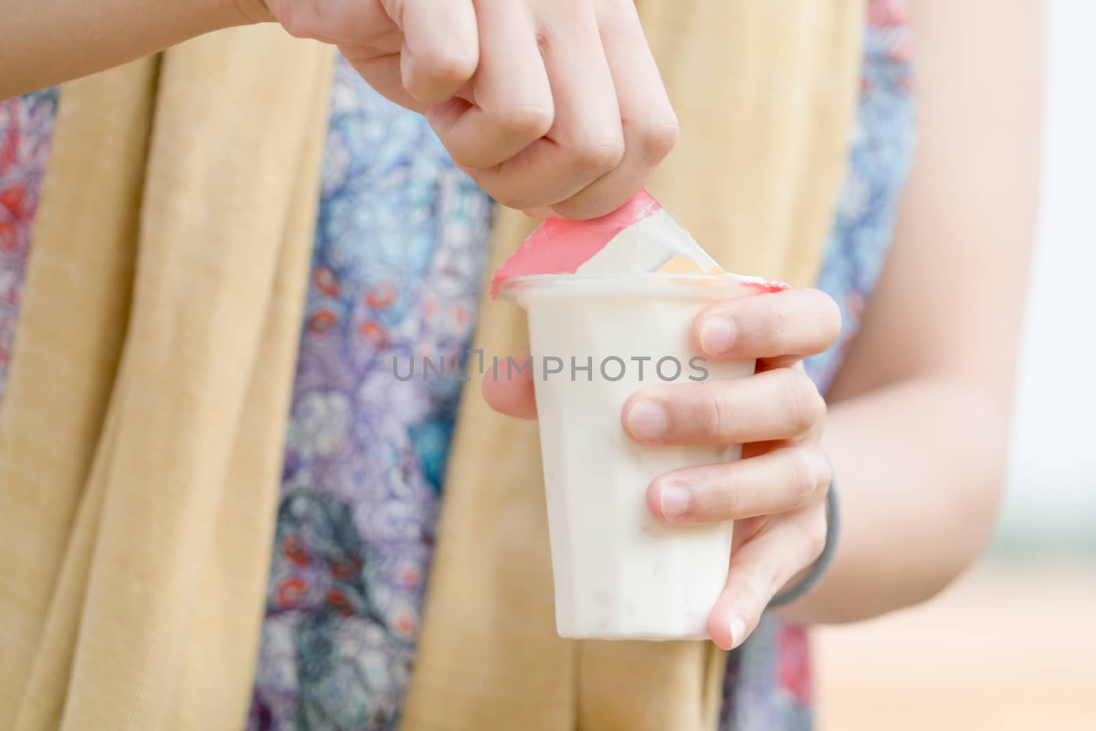 women hand opening  the fruit salad soy milk jelly, yogurt, dessert, healthy, sweet, yummy