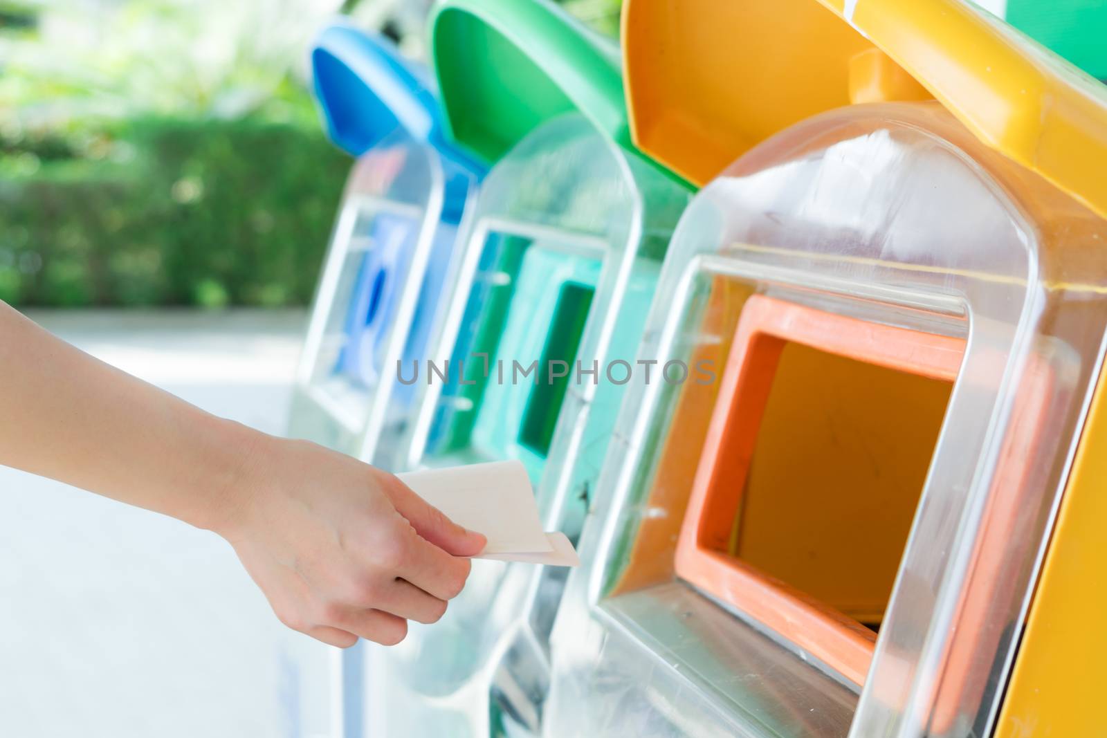 women hand throwing away the garbage to the bin/trash, sorting waste/garbage before drop to the bin