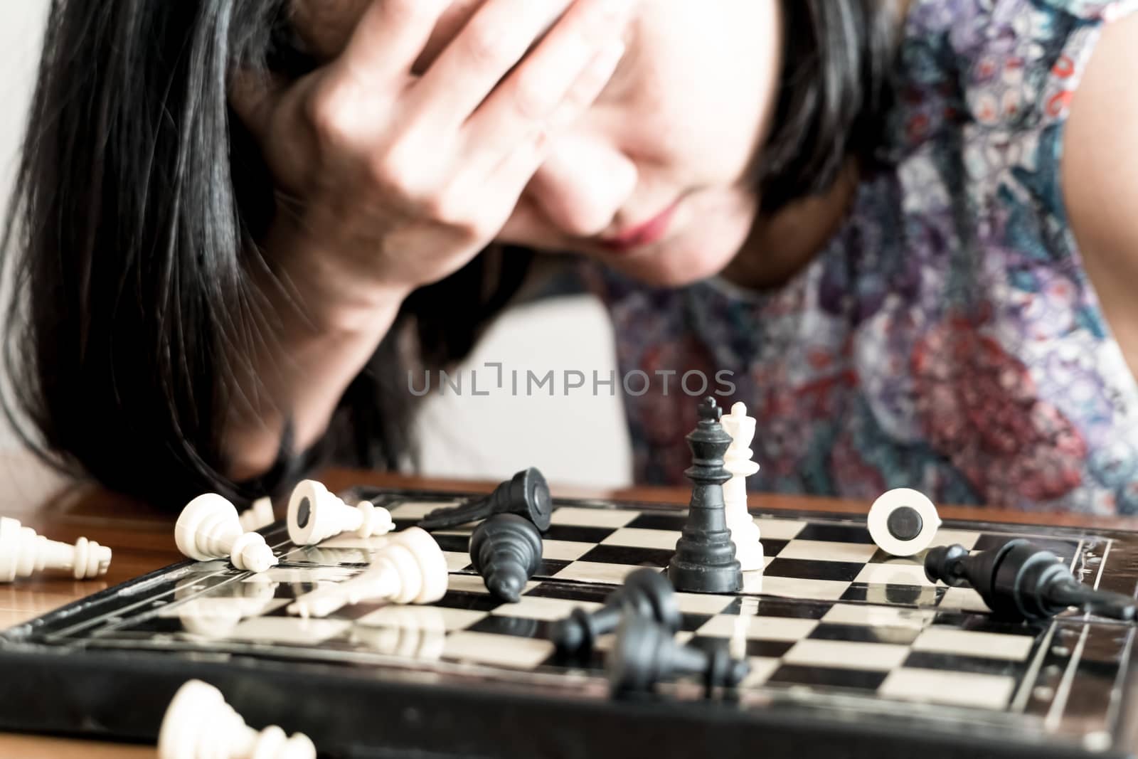 the loser women sad after  fighting the chess, committed, competition, winner, successful, dedicate concept