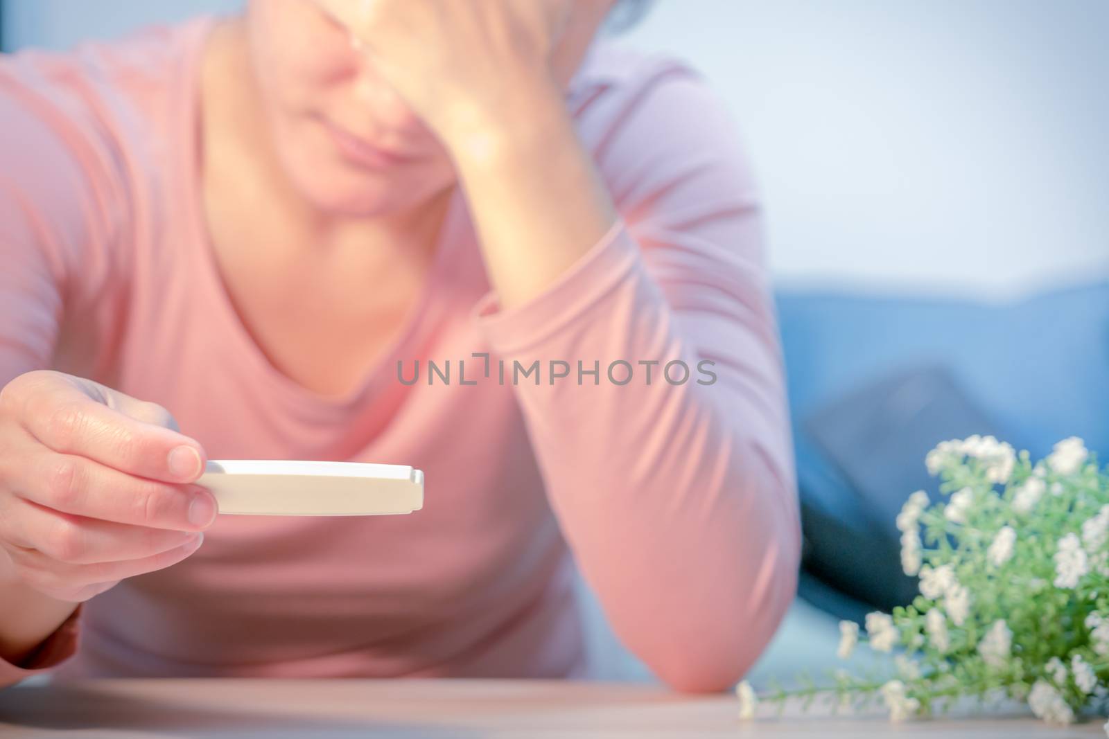 soft focus on sad women hand hold the pregnant test pad after saw the negative  test result