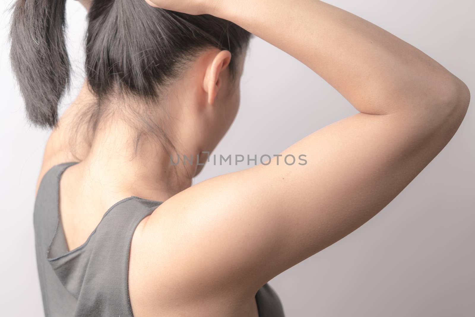 rear view of women tightening the hair, lifestyle concept