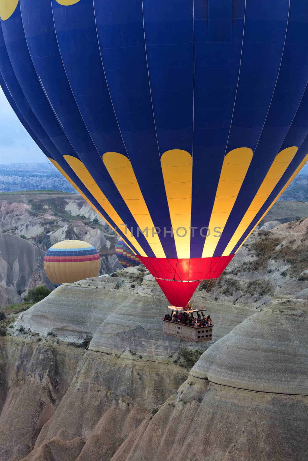 A balloon is flying over the valley in Cappadocia. 12.05.2018. Turkey. by Sergii