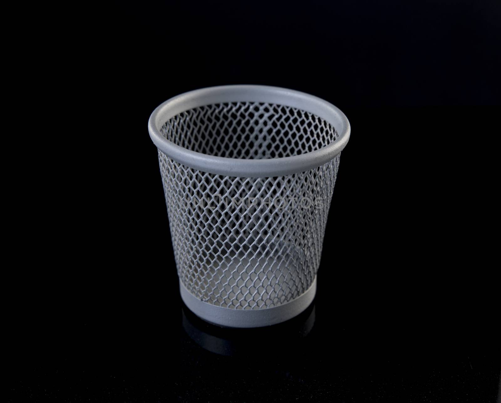 metal pen tray or trash can for the desk on black background