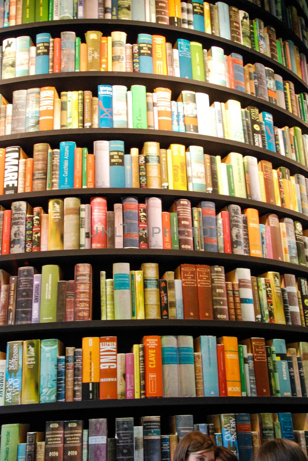 Books in a tower-shaped bookcase