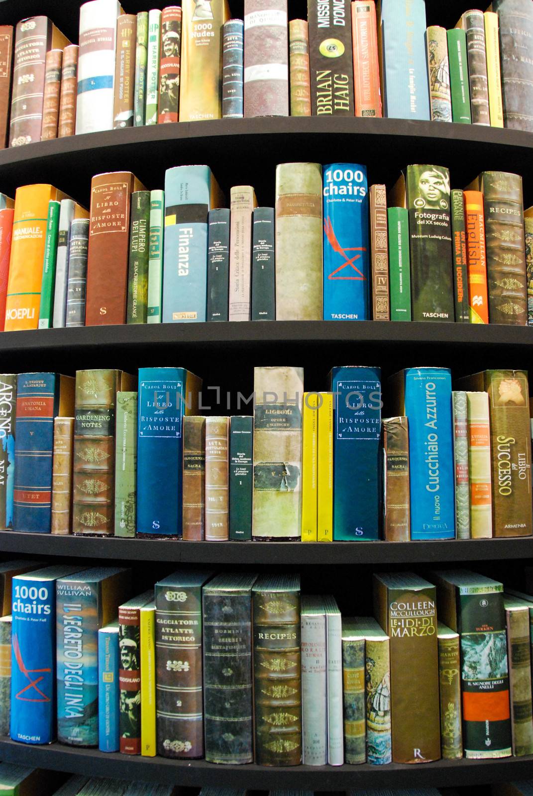 Detail of books in a tower-shaped bookcase - Turin, Italy - May 2011