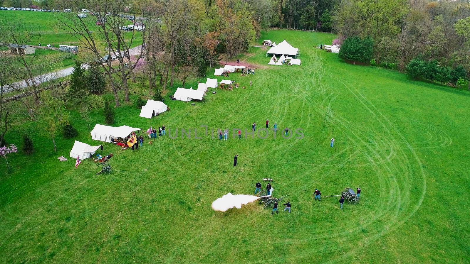 Aerial View of a Civil War Reenactment Cannon Firing on a Sunny Summer Day as Seen by a Drone
