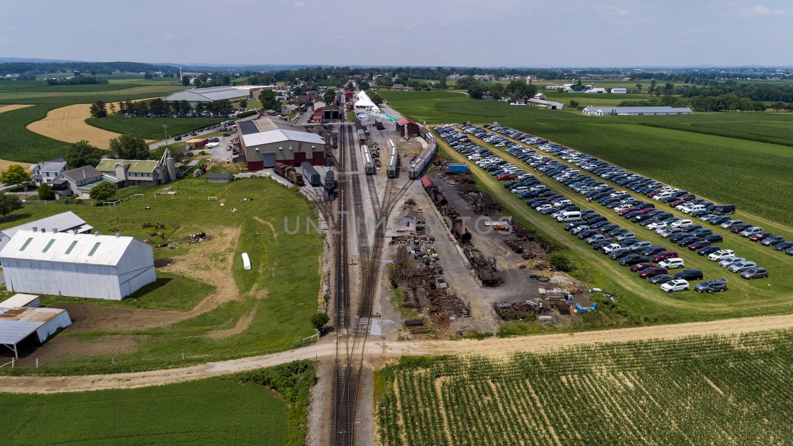 Aerial View of Train Yard Waiting for Trains on a Sunny Summer Day
