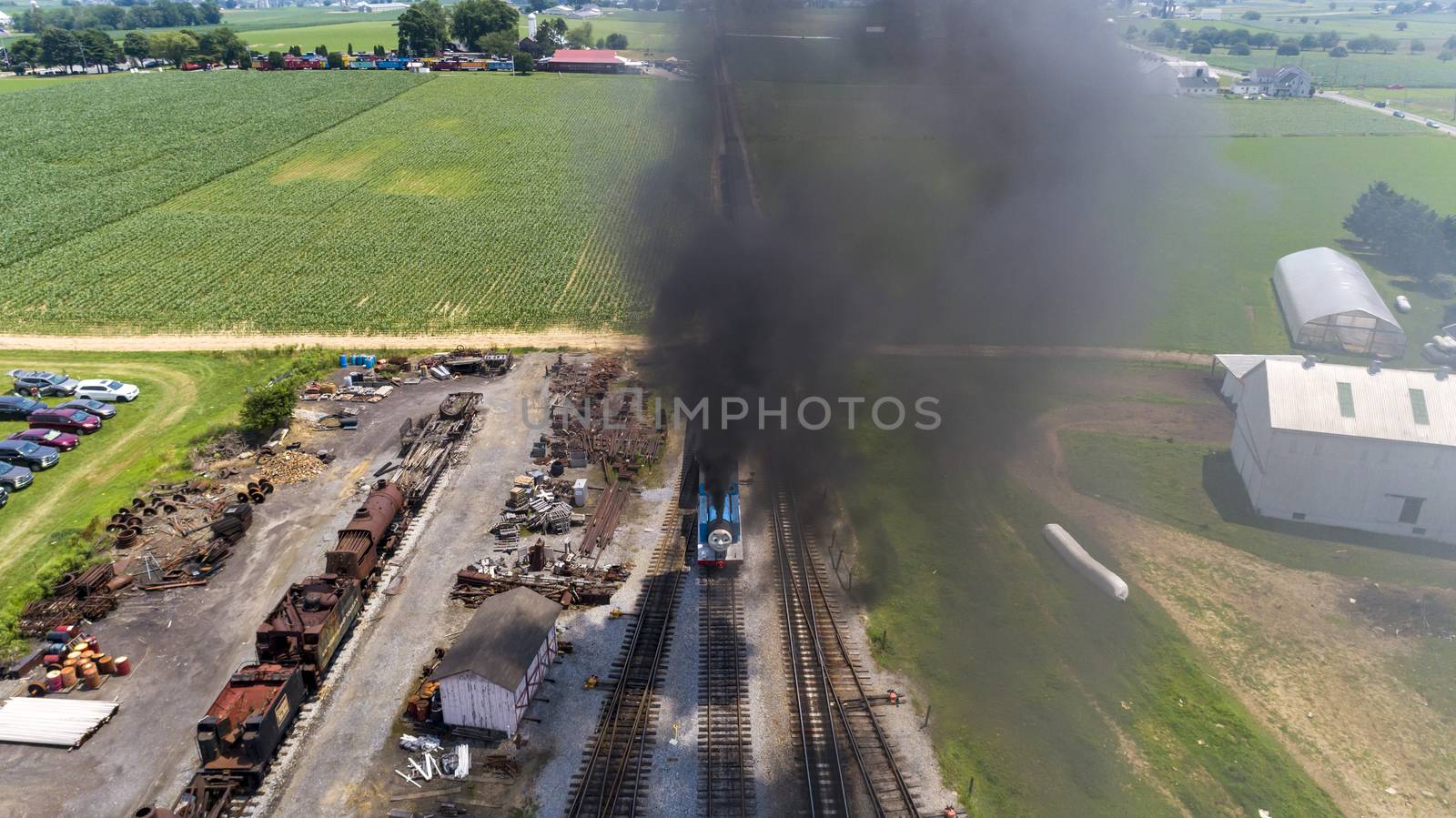 Aerial View of Train Yard Waiting for Thomas the Train Puffing Smoke on a Sunny Summer Day