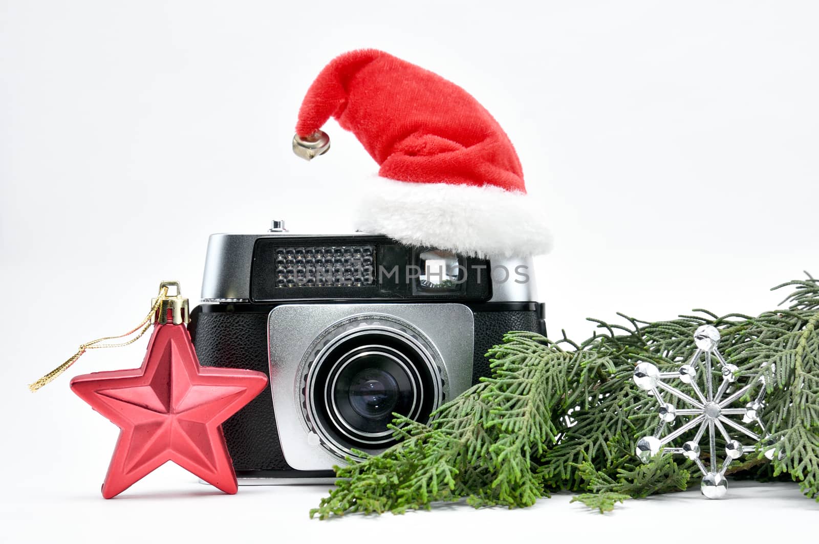 Vintage camera surrounded by Christmas toys, Santa's Christmas tree and caps.For Isolation.